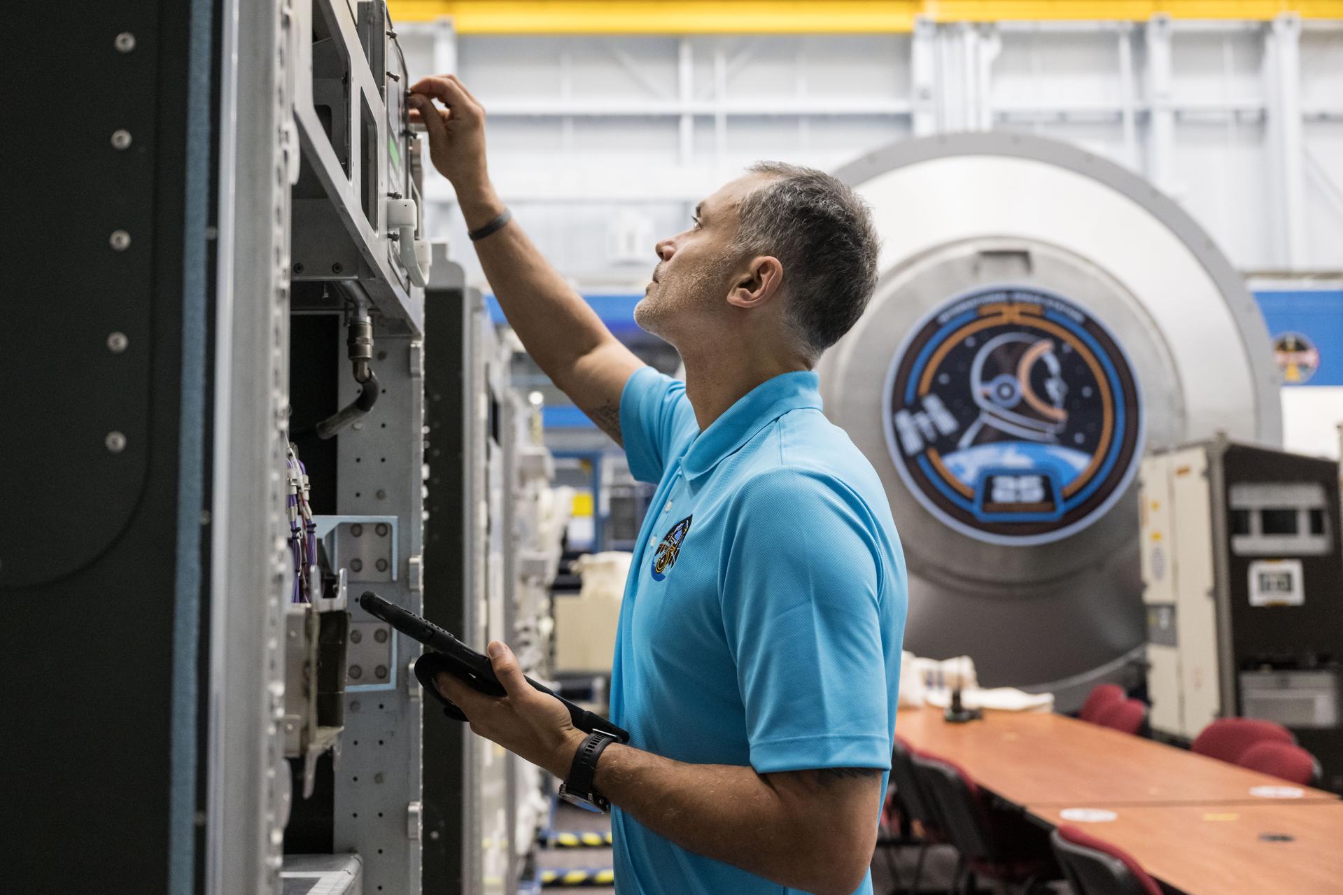 NASA astronaut and Expedition 75 flight engineer Anil Menon participates in a training session at Johnson Space Center's Space Vehicle Mockup Facility in Houston, Texas, ahead of his upcoming mission to the International Space Station.