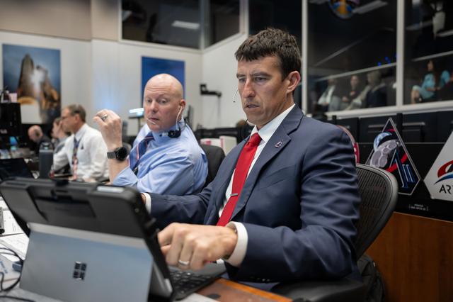 NASA flight directors Rick Henfling (right) and Judd Frieling...