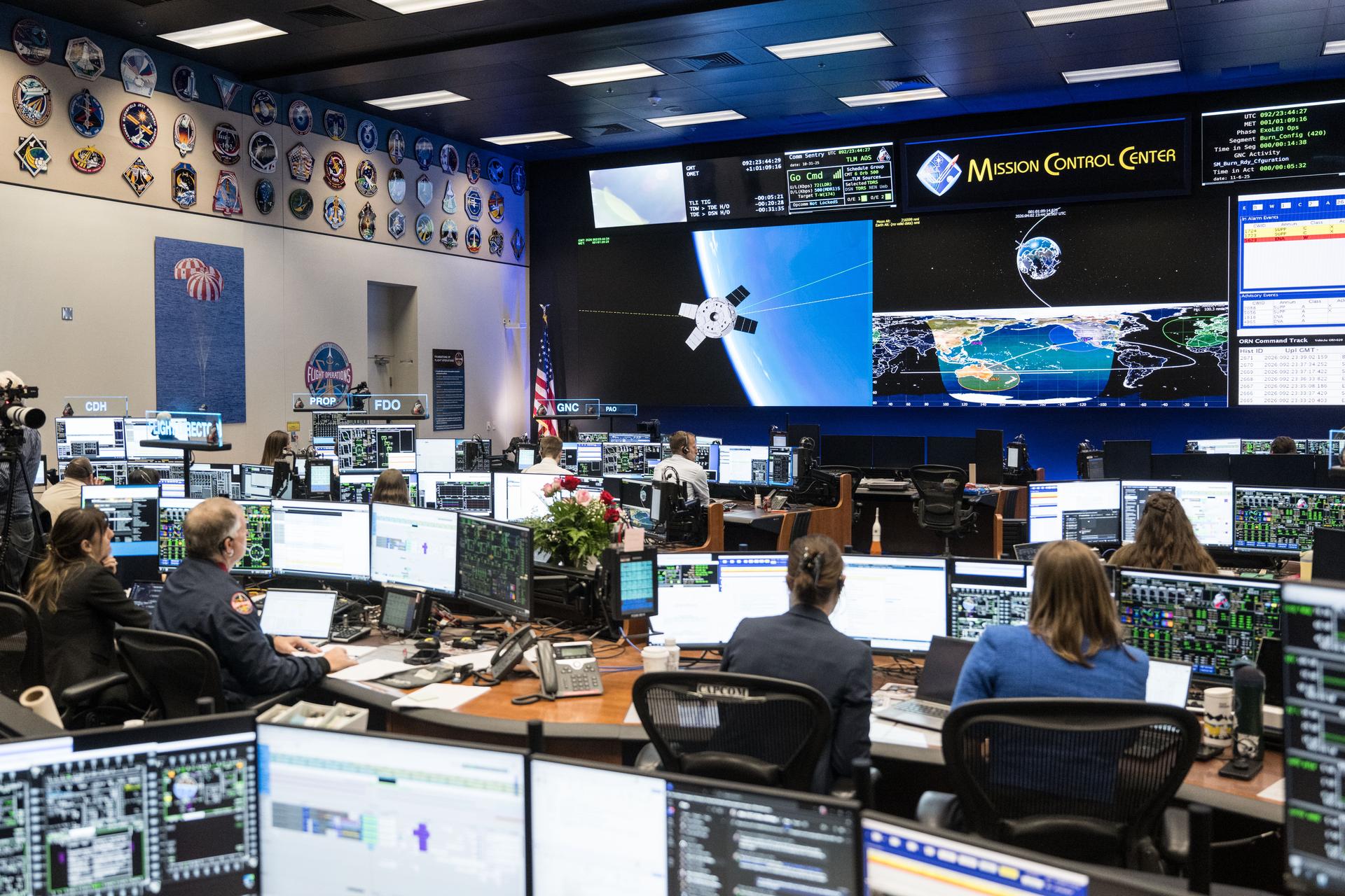 jsc2026e019618 (April 2, 2026) – The Artemis II flight control team pictured at the White Flight Control Room in the Mission Control Center at NASA’s Johnson Space Center monitors mission operations during the translunar injection (TLI) burn, which sent the crew in Orion out of Earth orbit and on a trajectory toward the Moon. After the mission management team polled “Go” for the operation, NASA’s Orion spacecraft fired its main engine for five minutes and 50 seconds beginning at 7:49 p.m. ET, to successfully complete the TLI burn.