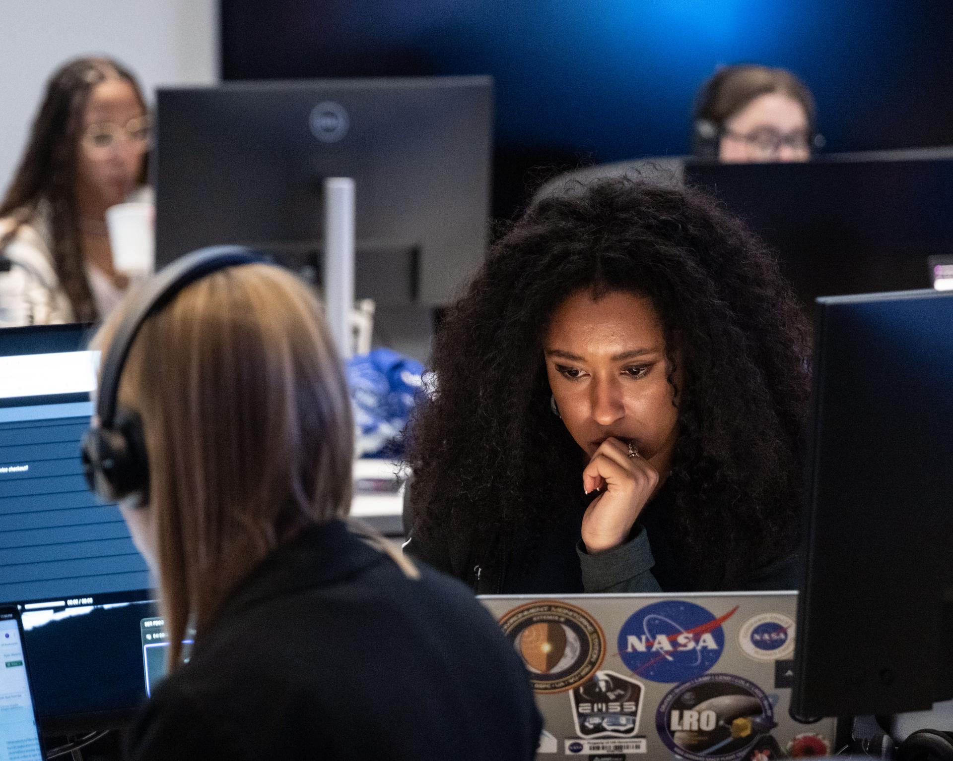Artemis II lunar science team member, Amber Turner, works on the lunar targeting plan for the astronauts' several-hour flyby of the Moon, scheduled for April 6. As they pass the Moon, the crew will apply geology skills learned in the classroom and in Moon-like environments on Earth to photograph and describe features including impact craters, ancient lava flows, and surface cracks and ridges formed as the Moon slowly changed over time. They will note differences in color, brightness, and texture, which provide clues that help scientists understand what the surface is made of and how it formed. Credits: NASA/Bill Stafford