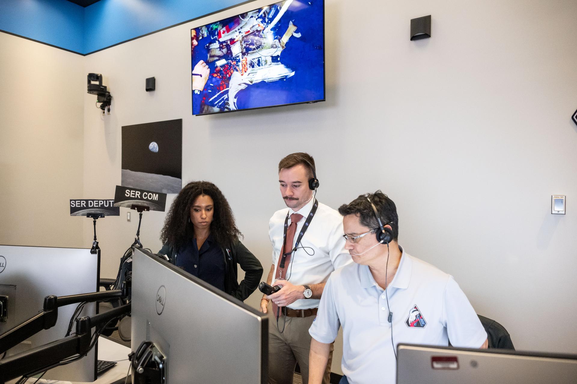 Artemis II lunar science team members, from left, Amber Turner, Jacob Richardson, Jose Hurtado, discuss the team's progress on the lunar targeting plan for the astronauts' six-hour flyby of the Moon, scheduled for April 6. As they pass the Moon, the crew will apply geology skills learned in the classroom and in Moon-like environments on Earth to photograph and describe features including impact craters, ancient lava flows, and surface cracks and ridges formed as the Moon slowly changed over time. They will note differences in color, brightness, and texture, which provide clues that help scientists understand what the surface is made of and how it formed. Credits: NASA/Bill Stafford