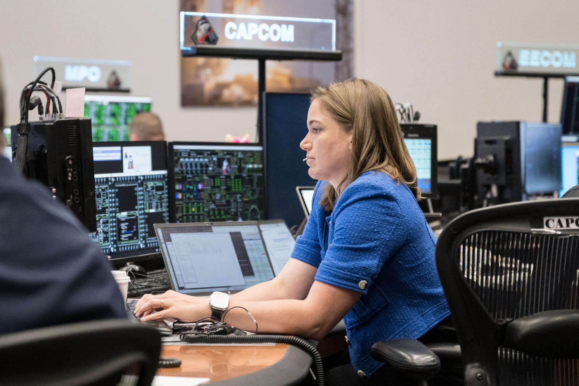 jsc2026e020046 (April 2, 2026) – CSA (Canadian Space Agency) astronaut and backup Artemis II crew member Jenni Gibbons serves as capsule communicator (capcom) during the mission’s translunar injection burn, which sent the crew in Orion out of Earth orbit and on a trajectory toward the Moon.