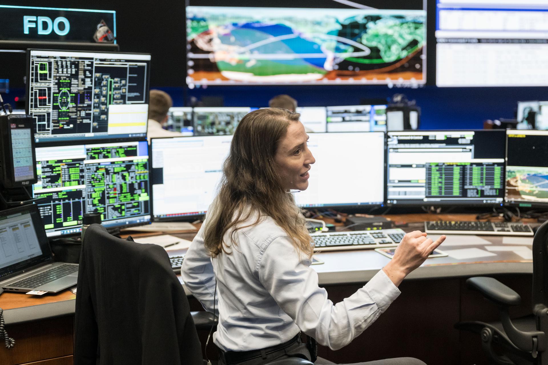 jsc2026e020048 (April 2, 2026) – Flight Dynamics Officer Natasha Peake in Mission Control during Artemis II’s translunar injection burn on April 2, 2026, which not only sent the crew in Orion out of Earth orbit and on a trajectory toward the Moon, but also set them on the course that will ultimately bring them home for a splashdown in the Pacific Ocean.