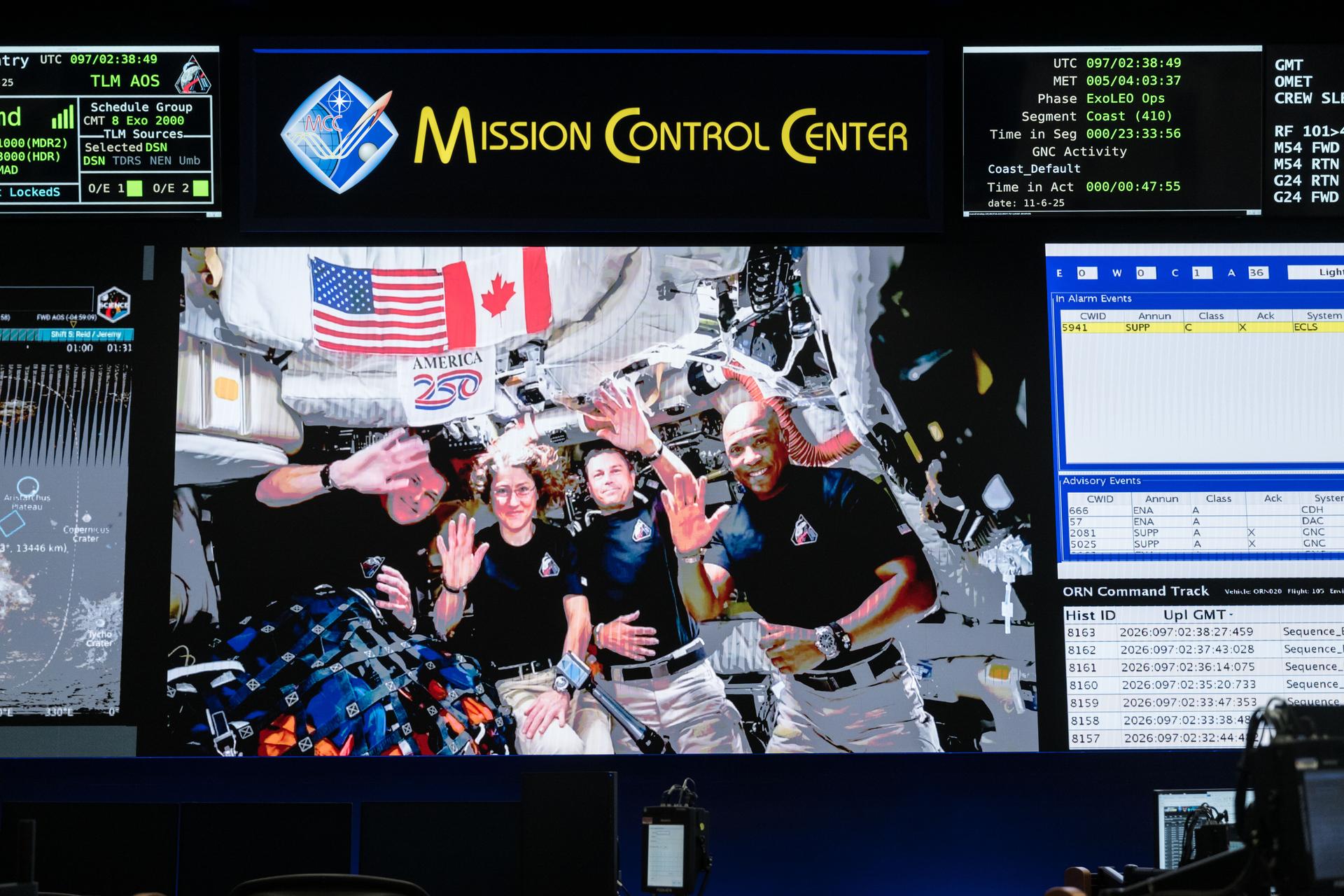 jsc2026e020504 (April 6, 2026) - The Artemis II crew – CSA (Canadian Space Agency) Astronaut Jeremy Hansen (far left) and...
