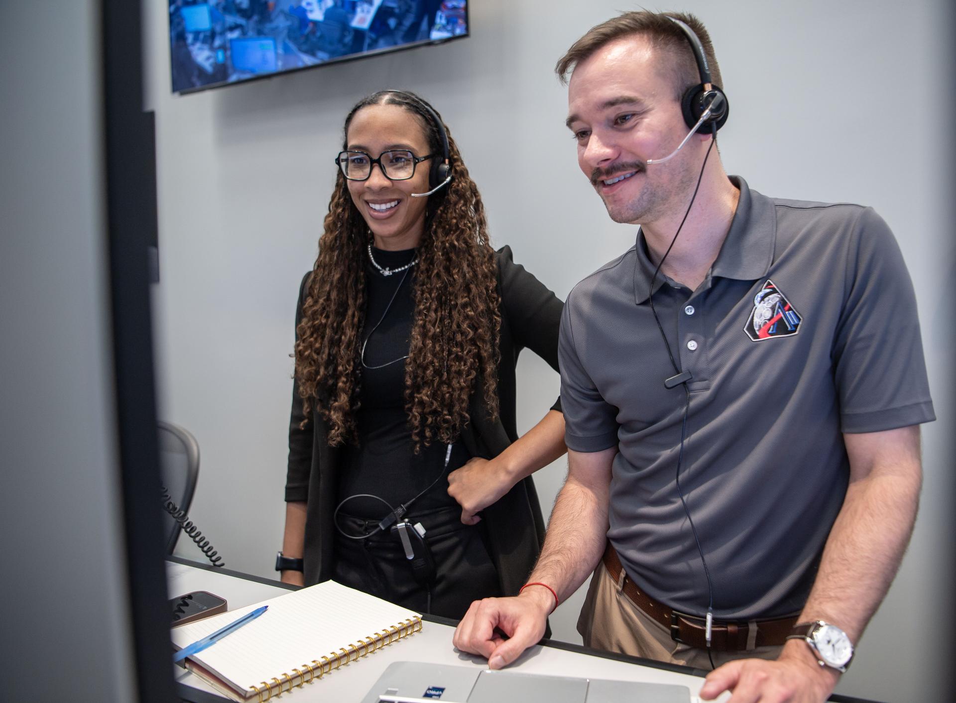 Artemis II Lunar Science Deputy Jacob Richardson and Artemis II Lunar Science Team Member Kiarre Dumes react to the astronauts' verbal observations of the Moon during their flyby on April 6. The science team trained the astronauts in geology both in the classroom and in the field. They also built the lunar targeting plan that, like a spacewalk plan, provides strong, detailed observation guidance, plus flexibility for the crew to make decisions based on what they’re seeing and experiencing in real time. The science team had many moments of celebration during the lunar flyby as the astronauts took pictures of the Moon and provided verbal descriptions of what they were seeing. This type of information reveals the geologic history of an area and will be critical to collect when future Artemis astronauts explore the Moon's surface. Credits: NASA/Luna Posadas Nava