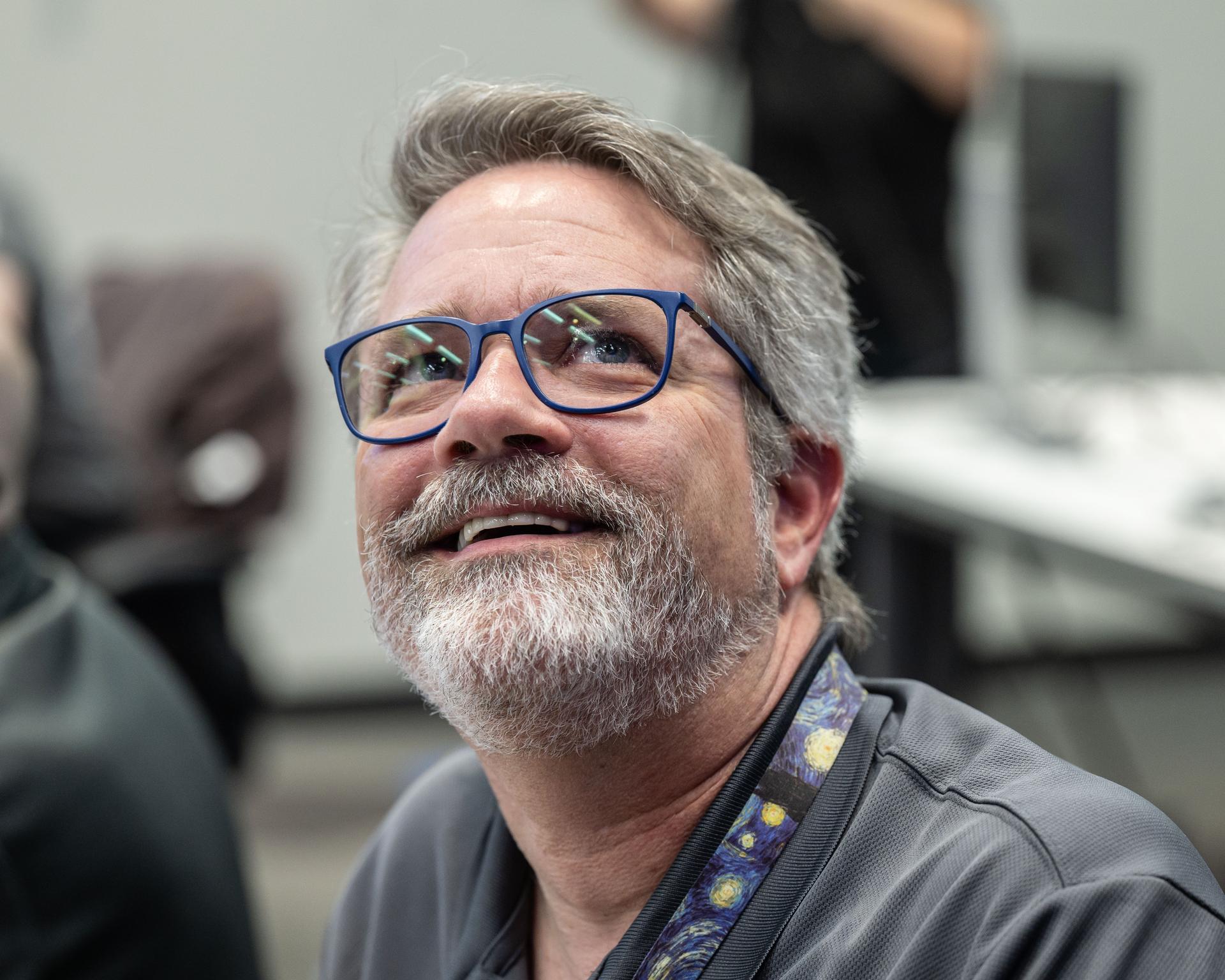 Ernie Wright, Artemis II lunar science visualization lead, reacts to hearing the astronauts describe features of the Moon as they few by on April 6, 2026. To prepare the crew for this mission, the Artemis II lunar science team trained the astronauts in geology, both in the classroom and in the field. They also built the lunar targeting plan that, which, like an International Space Station spacewalk plan, provides strong, detailed observation guidance, plus flexibility for the crew to make decisions based on what they’re seeing and experiencing in real time. The science team had many moments of celebration during the lunar flyby as the astronauts took images of the Moon and provided verbal descriptions of what they were seeing. This type of information reveals the geologic history of an area and will be critical to collect when future Artemis astronauts explore the Moon's surface. Credits: NASA/Luna Posadas Nava