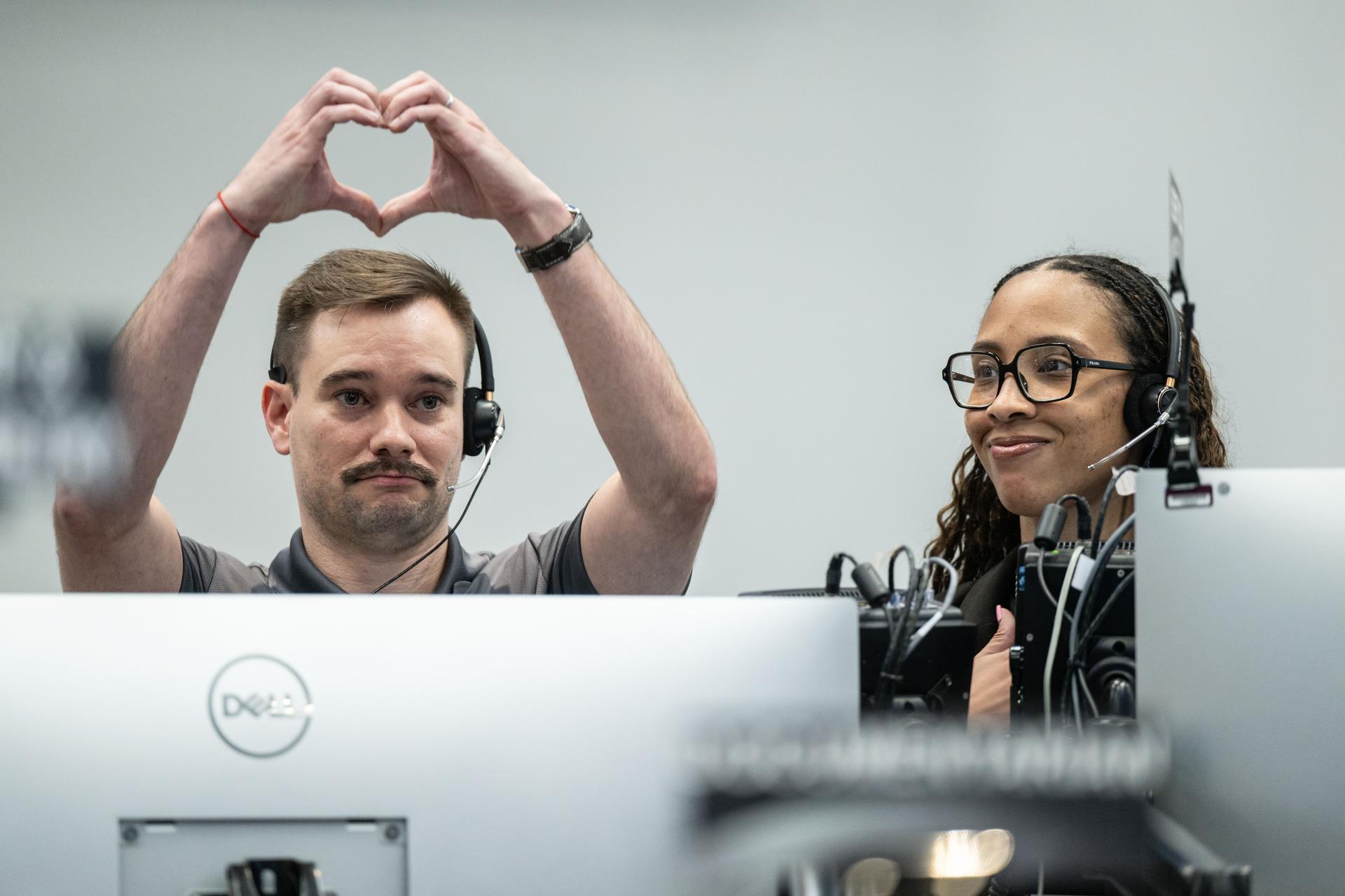 Artemis II deputy lunar science lead, Jacob Richardson, left, and Artemis II lunar science team members, Kiarre Dumes, react to the astronauts' verbal observations of the Moon during their flyby on April 6, 2026. Along with other lunar science team members, Richardson and Dumes helped train the crew in geology both in the classroom and in the field. The science team also built the lunar targeting plan that, like an International Space Station spacewalk plan, provides strong, detailed observation guidance, plus flexibility for the crew to make decisions based on what they’re seeing and experiencing in real time. The science team had many moments of celebration during the lunar flyby as the astronauts took images of the Moon and provided verbal descriptions of what they were seeing. This type of information reveals the geologic history of an area and will be critical to collect when future Artemis astronauts explore the Moon's surface. Credits: NASA/Luna Posadas Nava