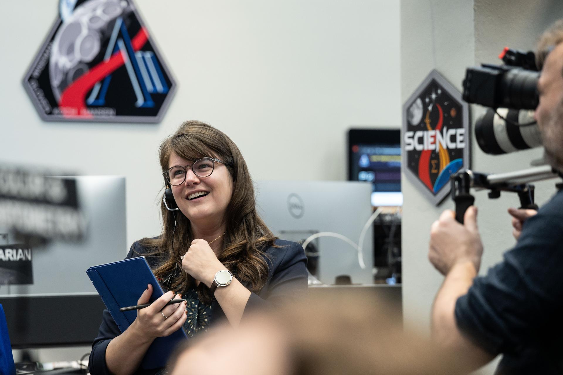 Artemis II deputy lunar science lead, Marie Henderson, reacts to the astronauts' verbal observations of the Moon during their flyby on April 6, 2026. Along with other lunar science team members, Ewing helped train the crew in geology both in the classroom and in the field. The science team also built the lunar targeting plan that, like an International Space Station spacewalk plan, provides strong, detailed observation guidance, plus flexibility for the crew to make decisions based on what they’re seeing and experiencing in real time. The science team had many moments of celebration during the lunar flyby as the astronauts took images of the Moon and provided verbal descriptions of what they were seeing. This type of information reveals the geologic history of an area and will be critical to collect when future Artemis astronauts explore the Moon's surface. Credits: NASA/Luna Posadas Nava