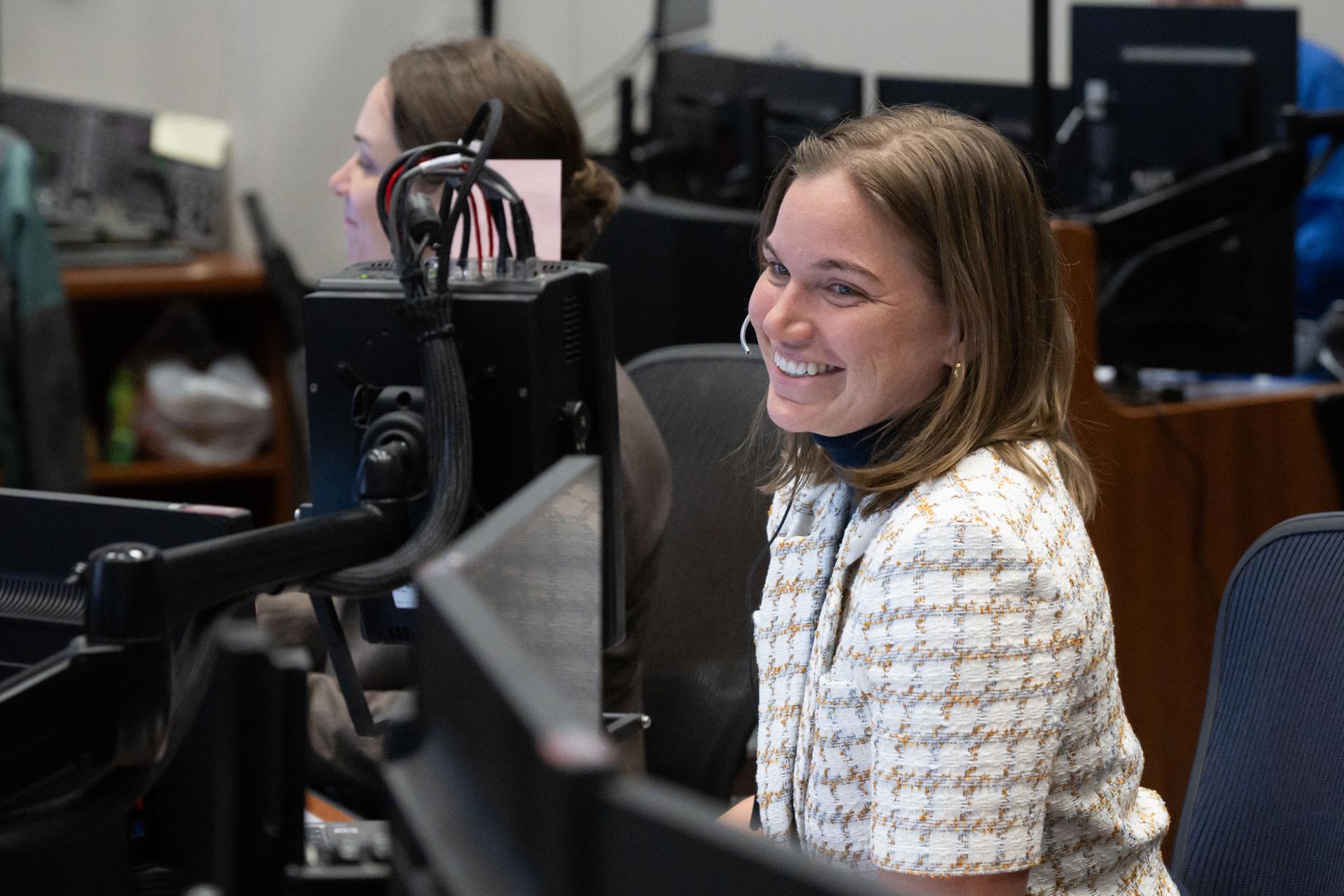 jsc2026e021107 (April 4, 2026) – CSA (Canadian Space Agency) astronaut and backup Artemis II crew member Jenni Gibbons serves as capsule communicator (capcom) during an Orion manual piloting demonstration on the fourth day of the mission. Credit: NASA/Bill Stafford