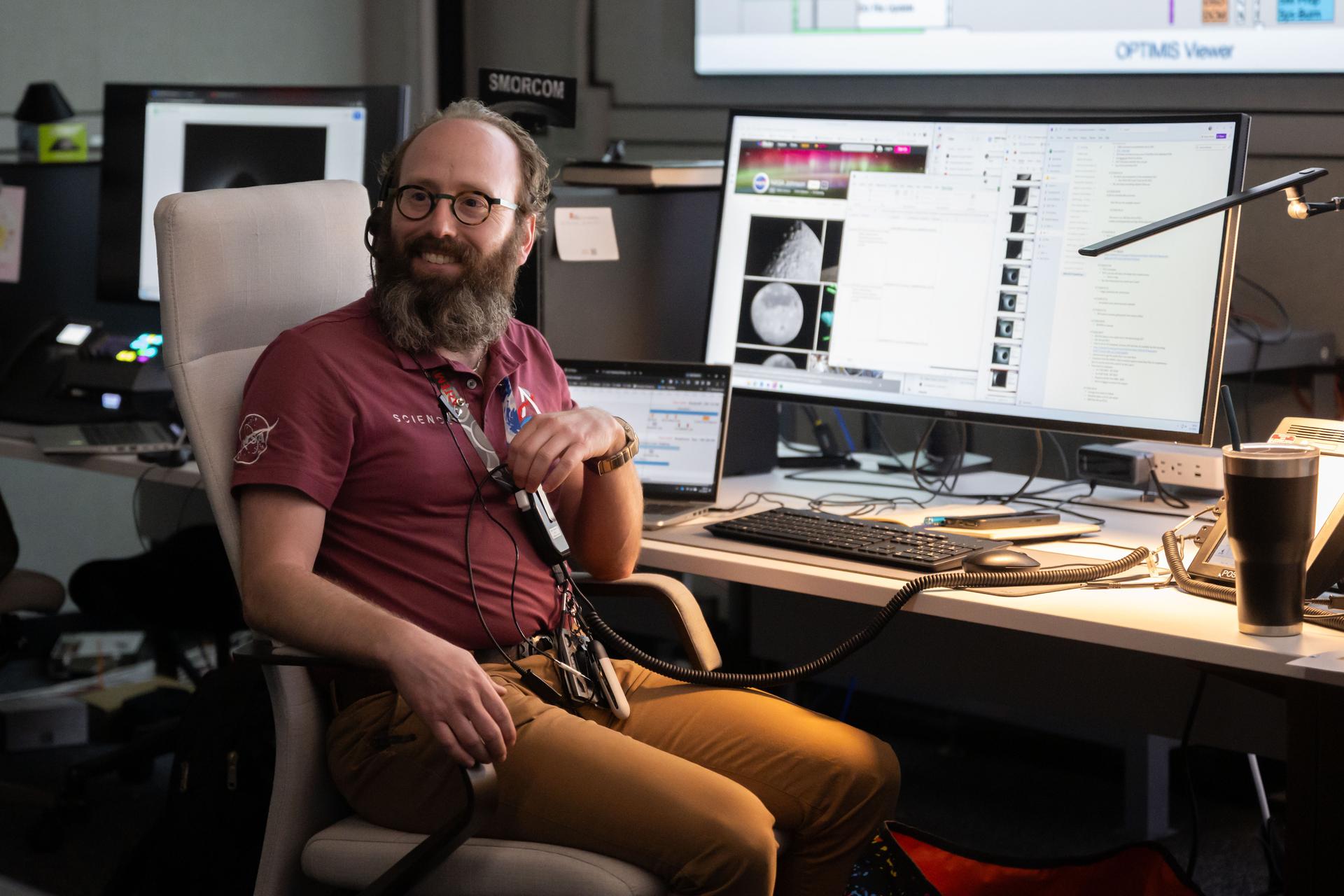 Artemis lunar science team member, Aaron Regberg, works in the Science Mission Operations Room, where scientists analyzed imagery and audio recordings of lunar observations captured by the Artemis II astronauts during their lunar flyby on April 6, 2026.
