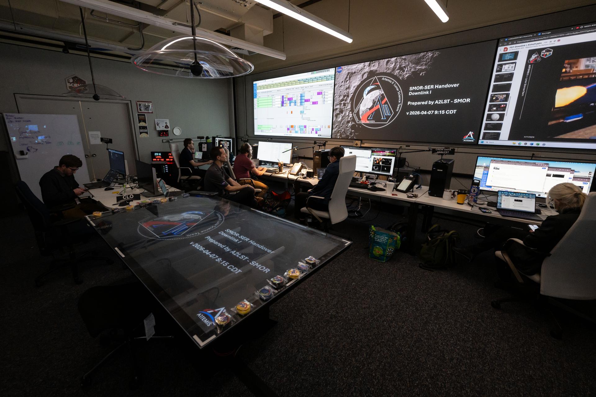 Artemis lunar science team members, work in the Science Mission Operations Room at NASA’s Johnson Space Center in Houston, analyzing imagery and audio recordings of lunar observations captured by the Artemis II astronauts during their lunar flyby on April 6, 2026.