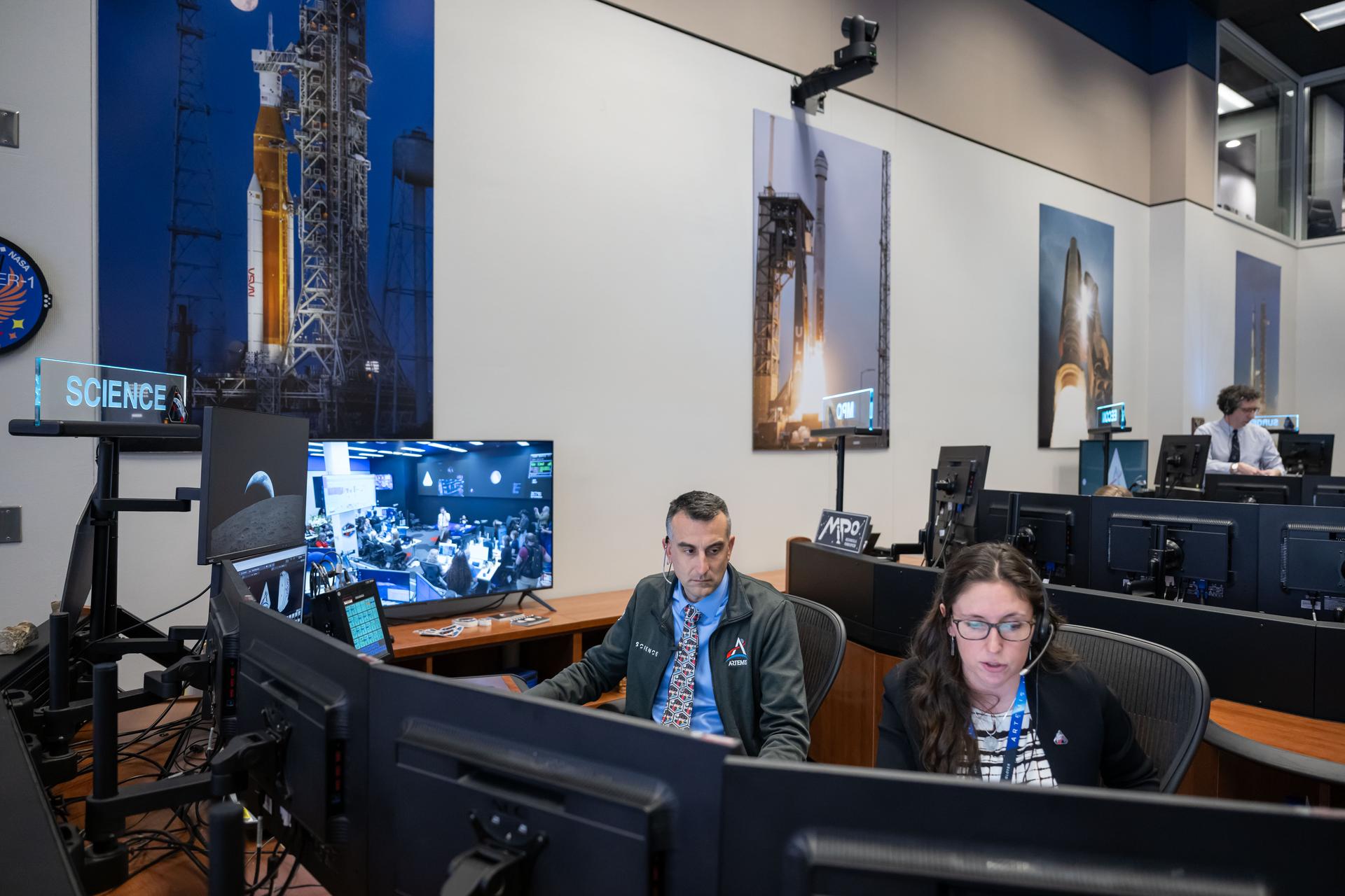 Artemis II Flight Control Team in White Flight Control Room (WFCR) during ISS Ship-to-Ship Call & Post Flyby Crew Debrief with Science Officer. Photo Date: April 7, 2026. Location: Building 30s, WFCR. Photo Credit: NASA/Robert Markowitz