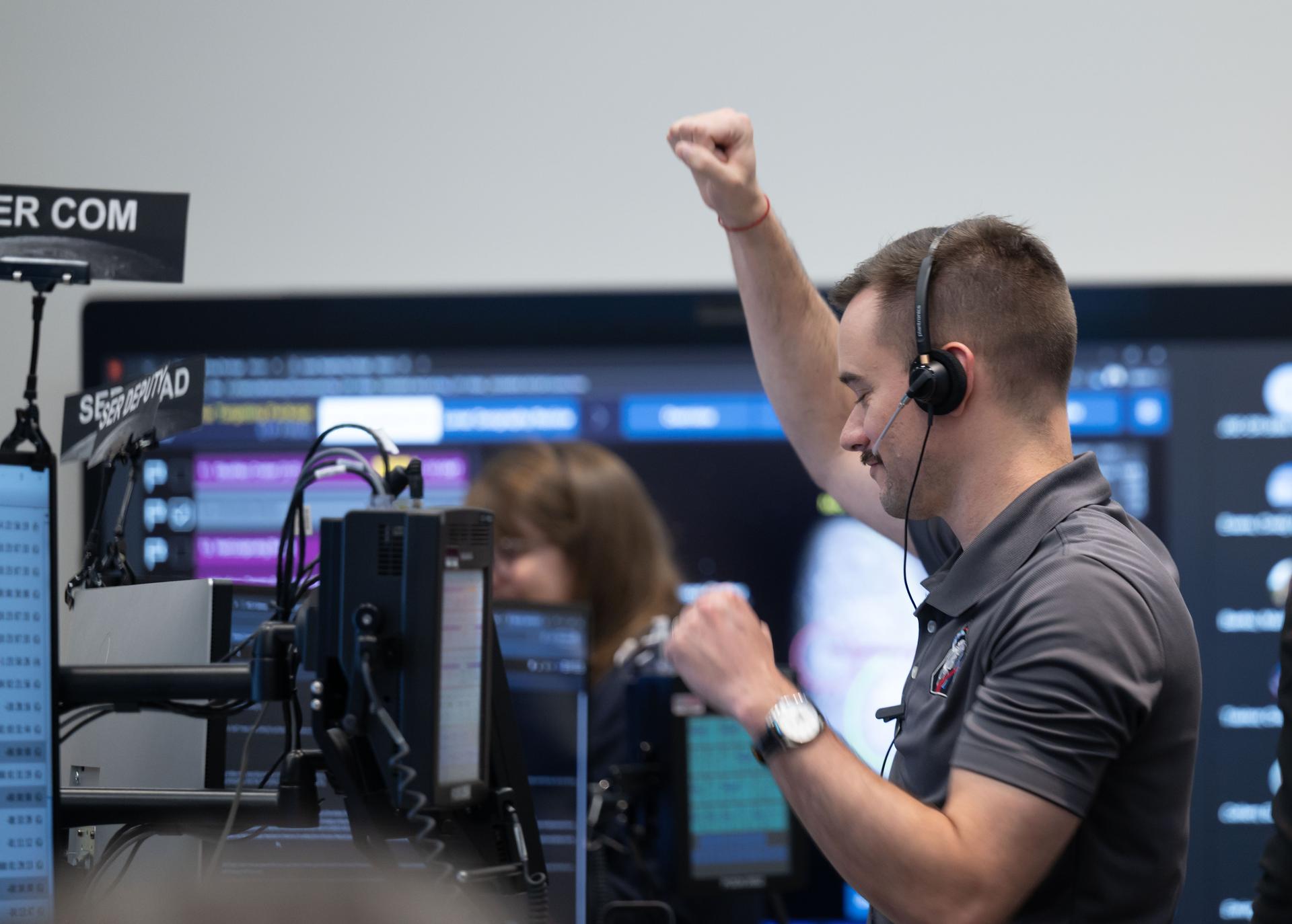 Artemis II deputy lunar science lead, Jacob Richardson, celebrates with a dance after hearing astronauts describe seeing impact flashes on the Moon during their lunar flyby on April 6, 2026. Richardson was monitoring the flyby from the Science Evaluation Room (SER) in Mission Control at NASA’s Johnson Space Center in Houston.  Built specifically for Artemis missions with these science priorities in mind, the SER is equipped to support rapid data interpretation, collaborative analysis, real-time decision making, and seamless coordination between the science and operations teams. Credits: NASA/Luna Posadas Nava