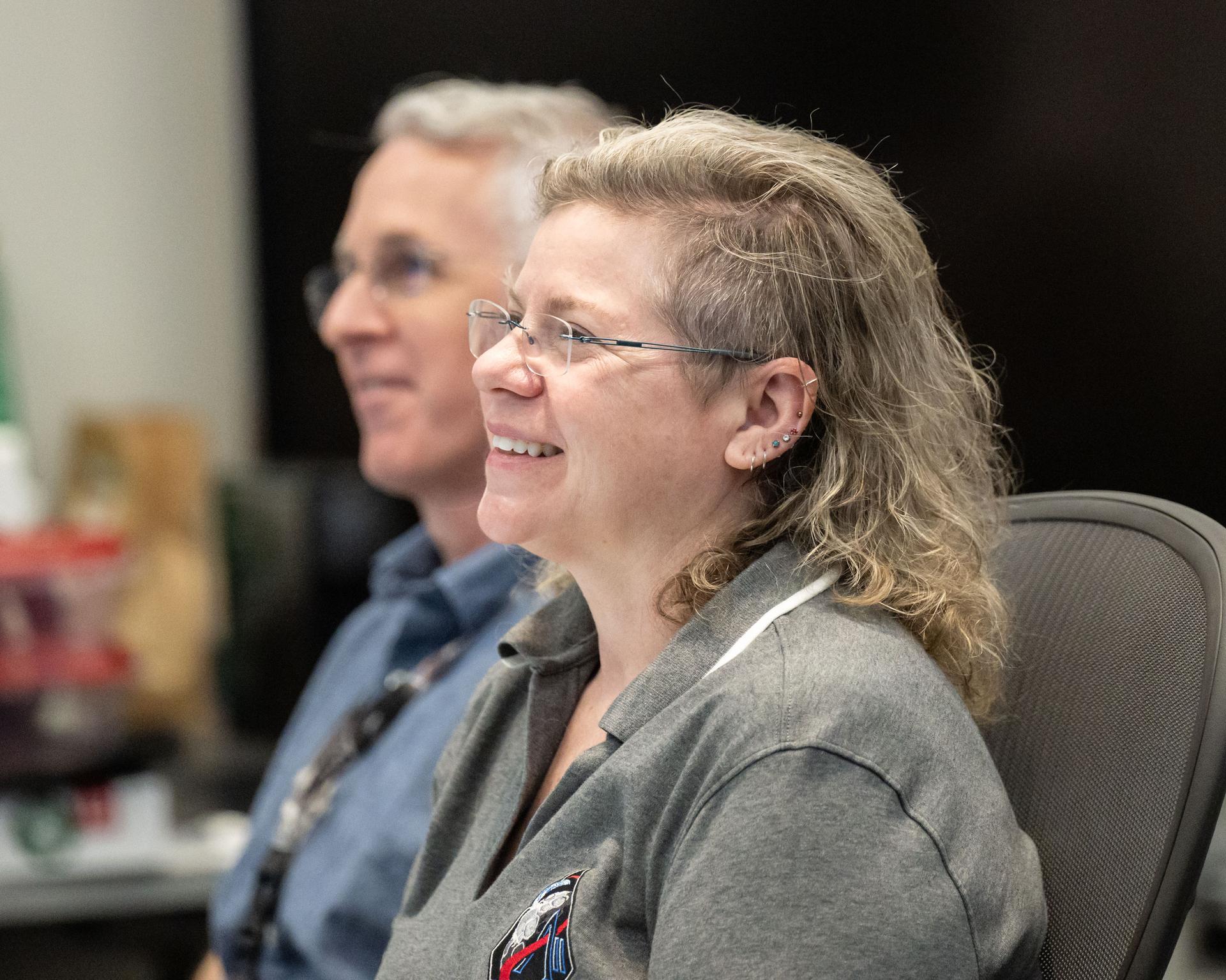 Artemis II lunar science team members, from left, Ryan Ewing, and Barbara Cohen, react to crew observations during the lunar flyby on April 6, 2026.  The team worked in the Science Evaluation Room (SER) in Mission Control at NASA’s Johnson Space Center in Houston. Built specifically for Artemis missions with these science priorities in mind, the SER is equipped to support rapid data interpretation, collaborative analysis, real-time decision making, and seamless coordination between the science and operations teams. Credits: NASA/Luna Posadas Nava