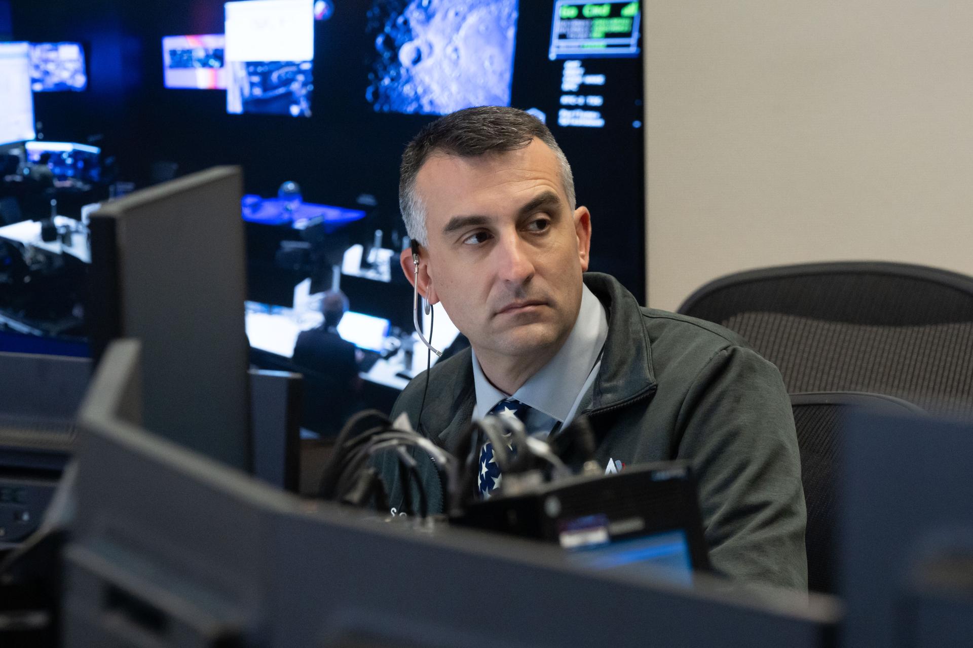 Artemis II science officer, Trevor Graff, is seen at the Science console in the White Flight Control Room in Mission Control at NASA's Johnson Space Center in Houston. Science officers are the senior flight controllers responsible for lunar science and geology objectives during Artemis missions. Credits: NASA/David DeHoyos