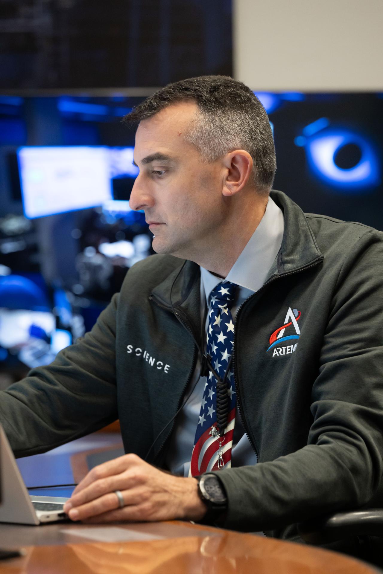 Artemis II science officer, Trevor Graff, is seen at the Science console in the White Flight Control Room in Mission Control at NASA's Johnson Space Center in Houston. Science officers are the senior flight controllers responsible for lunar science and geology objectives during Artemis missions. Credits: NASA/David DeHoyos