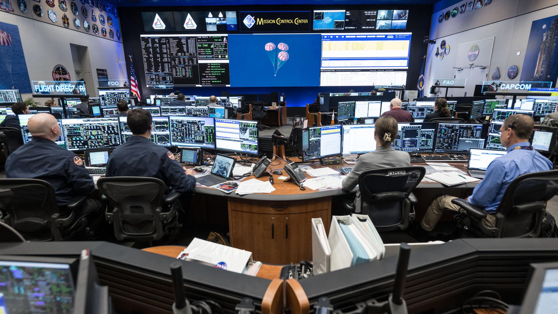 jsc2026e022251(April 10, 2026) - Artemis II Flight Control Team pictured at consoles within the White Flight Control Room in the...