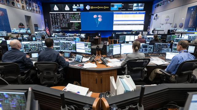Artemis II Flight Control Team pictured at consoles within...