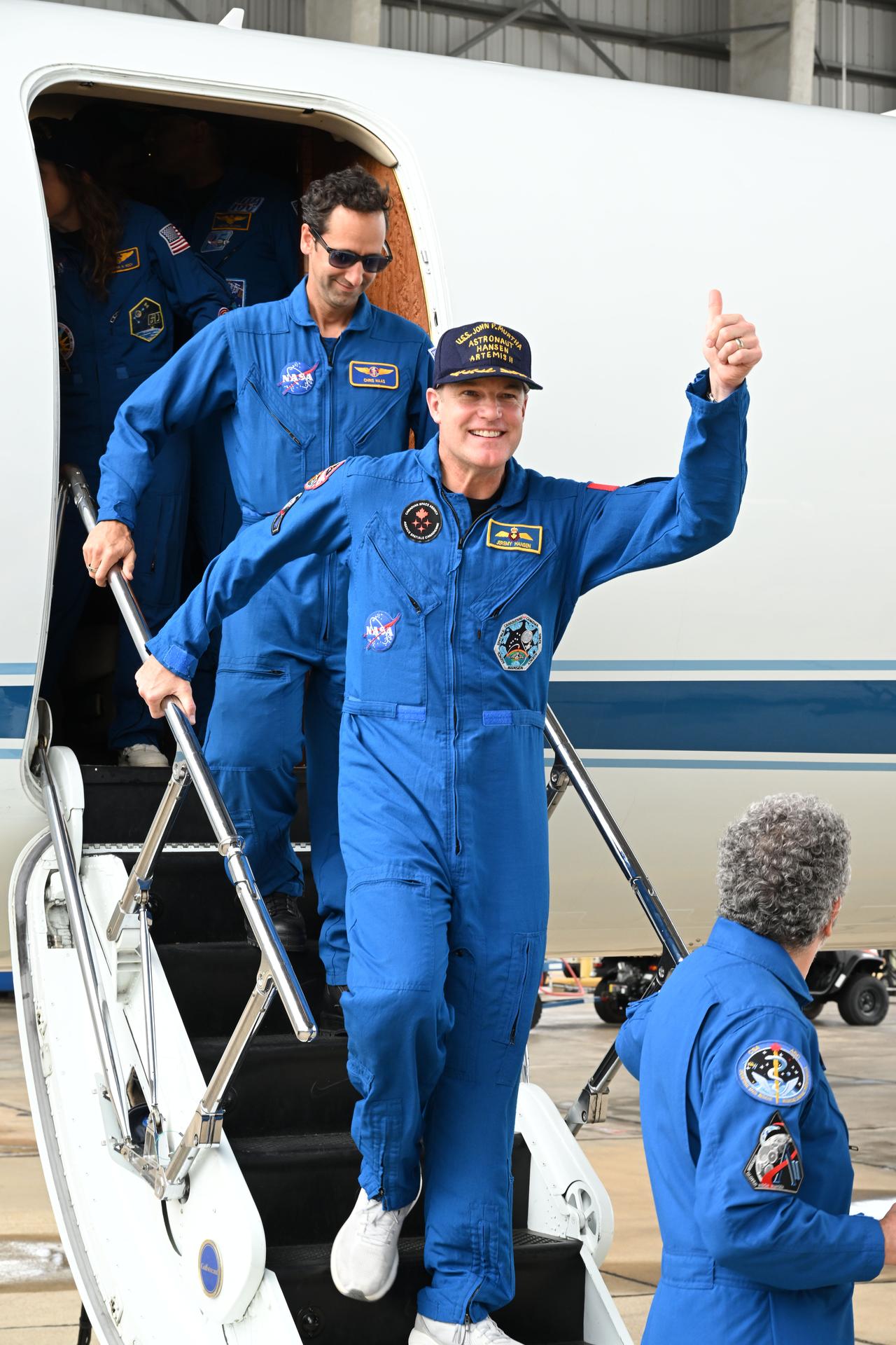 jsc2026e022272 (April 11, 2026) - Artemis II Mission Specialist Jeremy Hansen returns home to Houston, stepping off a plane at...