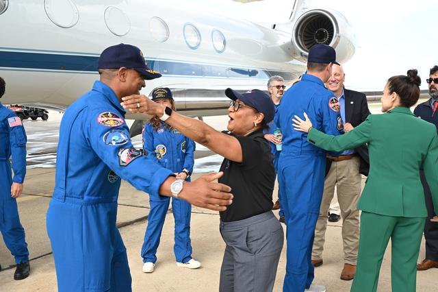 Artemis II Pilot Victor Glover is greeted by NASA's Johnson...