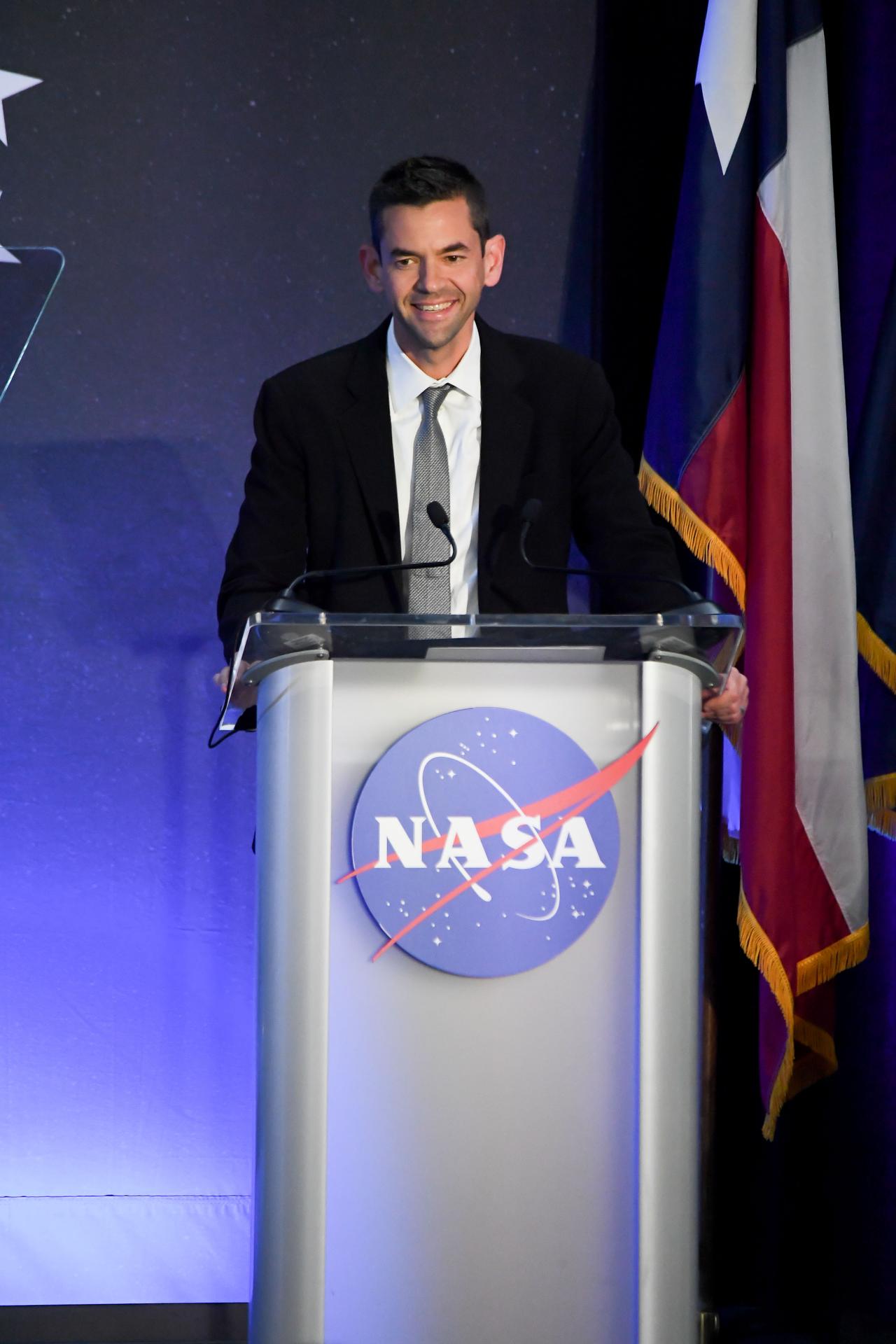 jsc2026e022287 (April 11, 2026) – NASA Administrator Jared Isaacman, addresses a crowd of friends, family, and colleagues assembled for the...