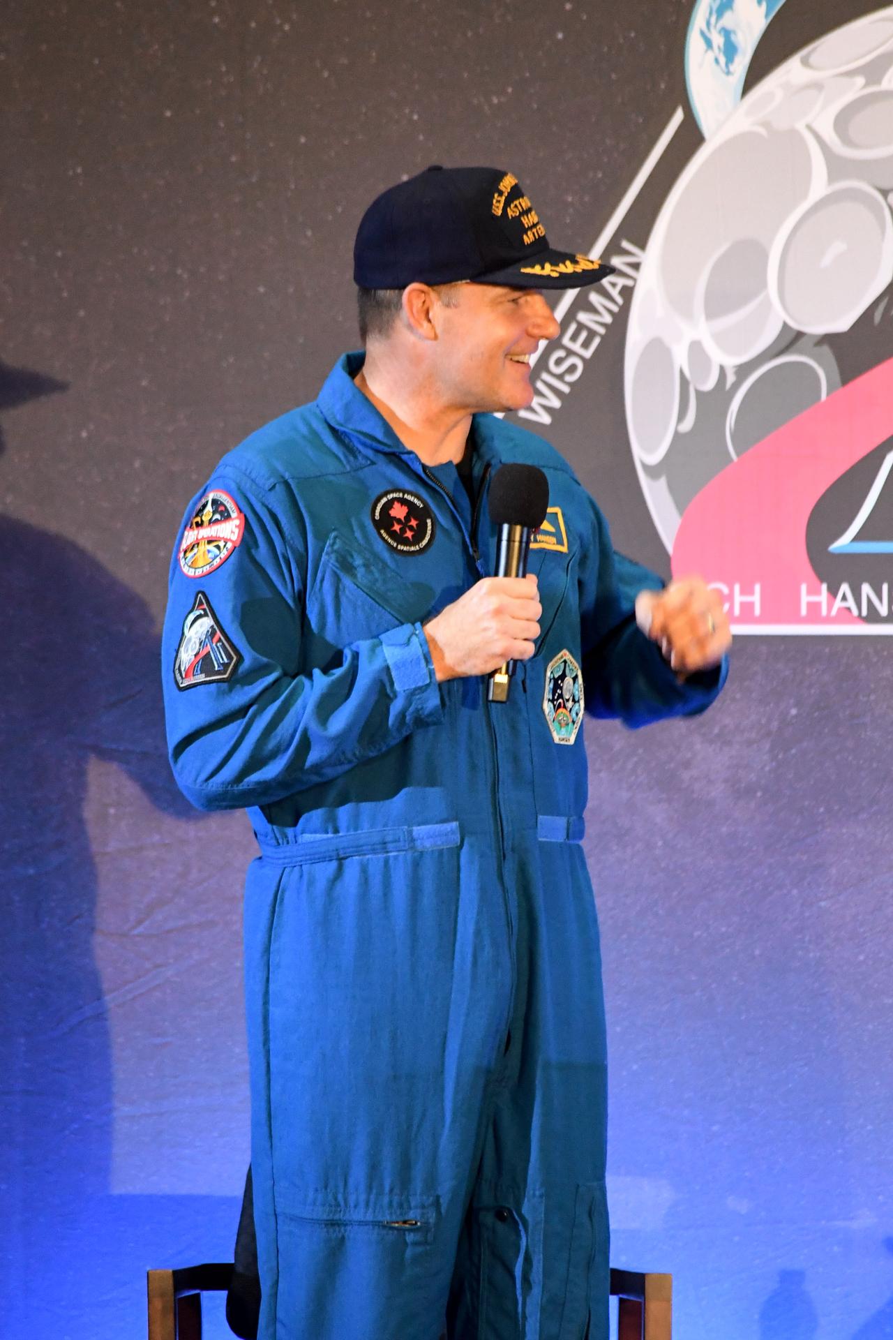 jsc2026e022294 (April 11, 2026) - CSA (Canadian Space Agency) astronaut Jeremy Hansen, shared brief remarks with friends, family, and colleagues after they landed at Ellington Airport near NASA’s Johnson Space Center in Houston on Saturday, April 11, 2026, after a nearly 10-day journey around the Moon and back to Earth. Credit: NASA/Bill Stafford