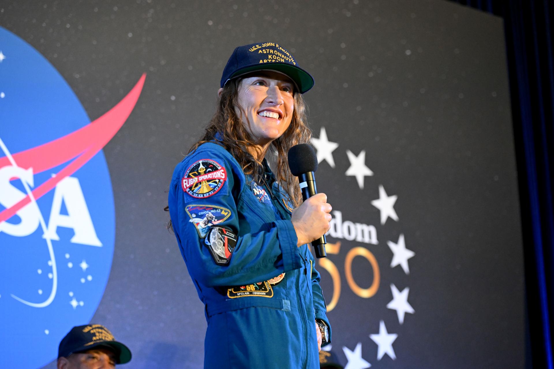 jsc2026e022296 (April 11, 2026) - NASA’s Artemis II mission specialist, Christina Koch, shared brief remarks with friends, family, and colleagues after they landed at Ellington Airport near NASA’s Johnson Space Center in Houston on Saturday, April 11, 2026, after a nearly 10-day journey around the Moon and back to Earth. Credit: NASA/Helen Arase Vargas