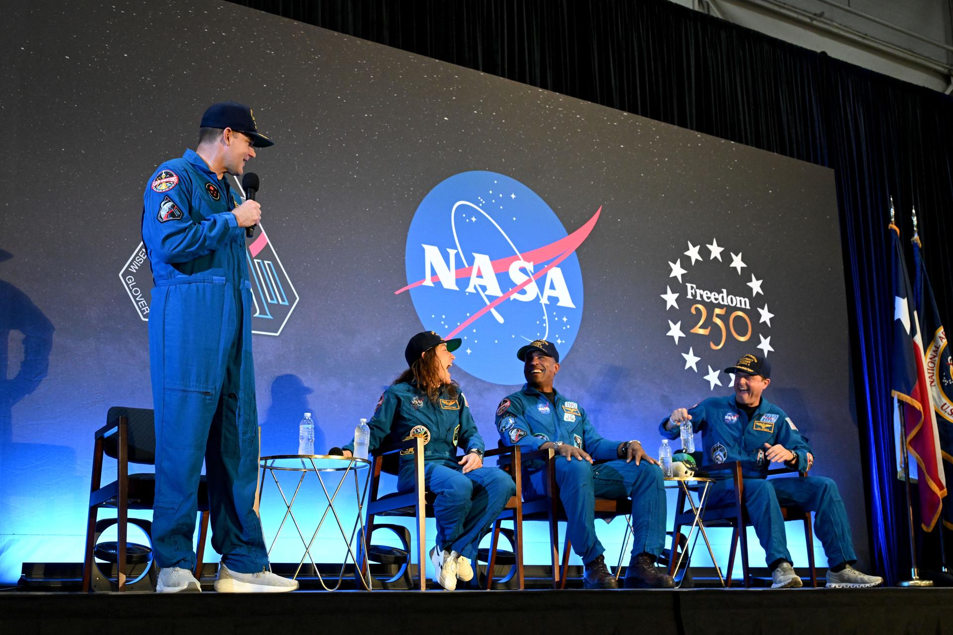 jsc2026e022297 (April 11, 2026) - NASA’s Artemis II crew, NASA astronauts Reid Wiseman, commander; Victor Glover, pilot; Christina Koch, mission specialist; and CSA (Canadian Space Agency) astronaut Jeremy Hansen, shared brief remarks with friends, family, and colleagues after they landed at Ellington Airport near NASA’s Johnson Space Center in Houston on Saturday, April 11, 2026, after a nearly 10-day journey around the Moon and back to Earth. Credit: NASA/Helen Arase Vargas