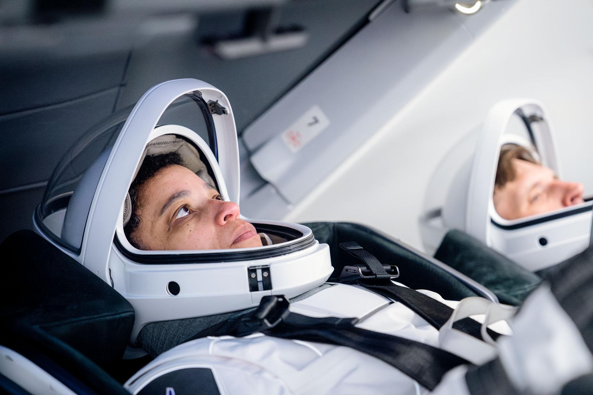 From left, SpaceX Crew-13 Commander Jessica Watkins of NASA and Mission Specialist Joshua Kutryk of CSA (Canadian Space Agency) are seated inside a SpaceX Dragon spacecraft during a training session at SpaceX headquarters in Hawthorne, California.