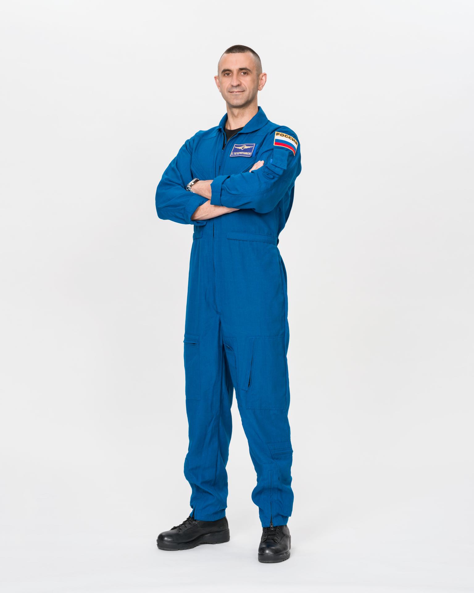 Cosmonaut Sergey Teteryatnikov of Roscosmos poses for an official portrait in a blue flight suit at NASA's Johnson Space Center in Houston, Texas. Teteryatnikov is serving as a mission specialist for NASA's SpaceX Crew-13 mission to the International Space Station.