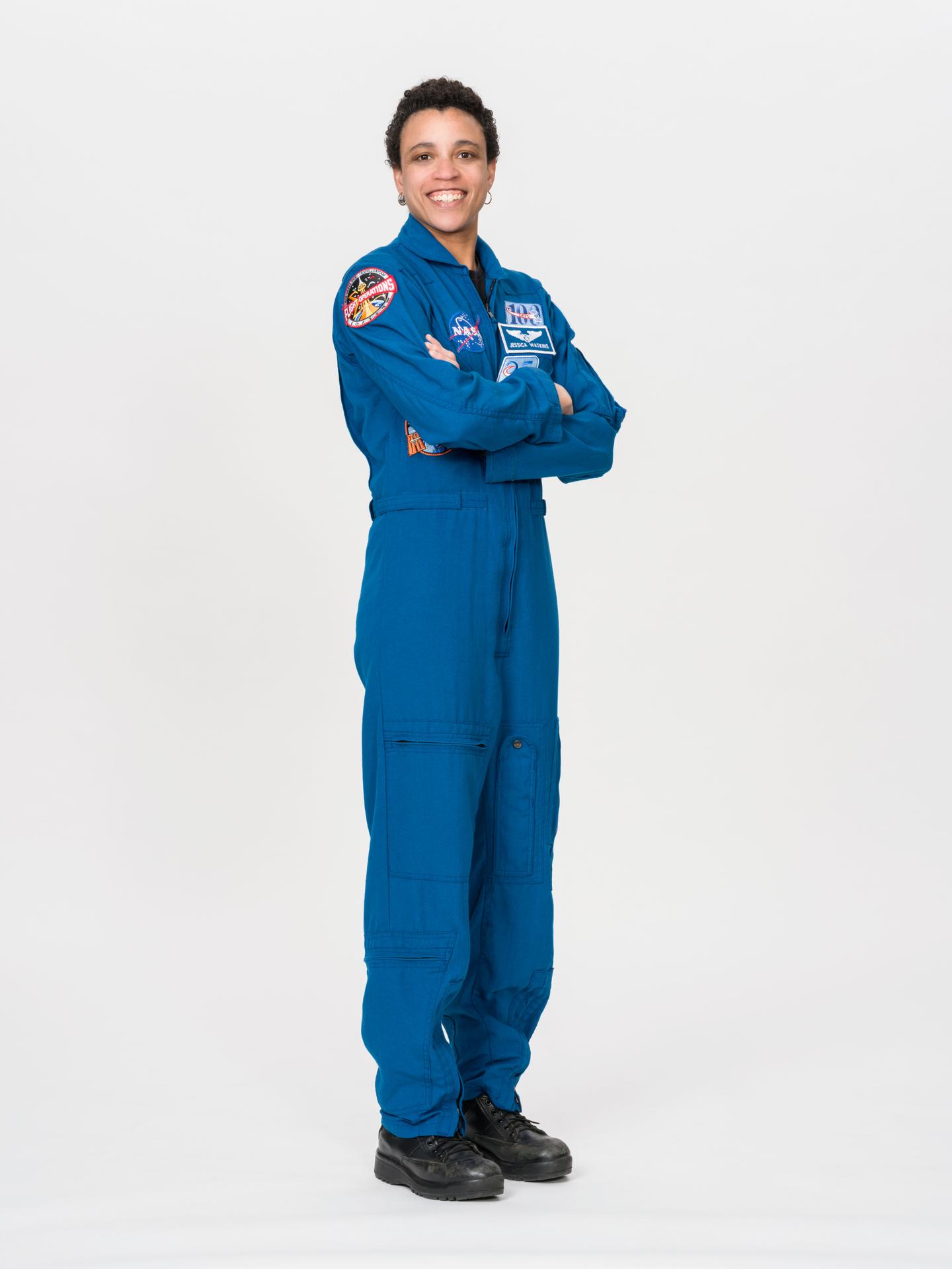 Astronaut Jessica Watkins of NASA poses for an official portrait in a blue flight suit at NASA's Johnson Space Center in Houston, Texas. Watkins is serving as commander for NASA's SpaceX Crew-13 mission to the International Space Station.