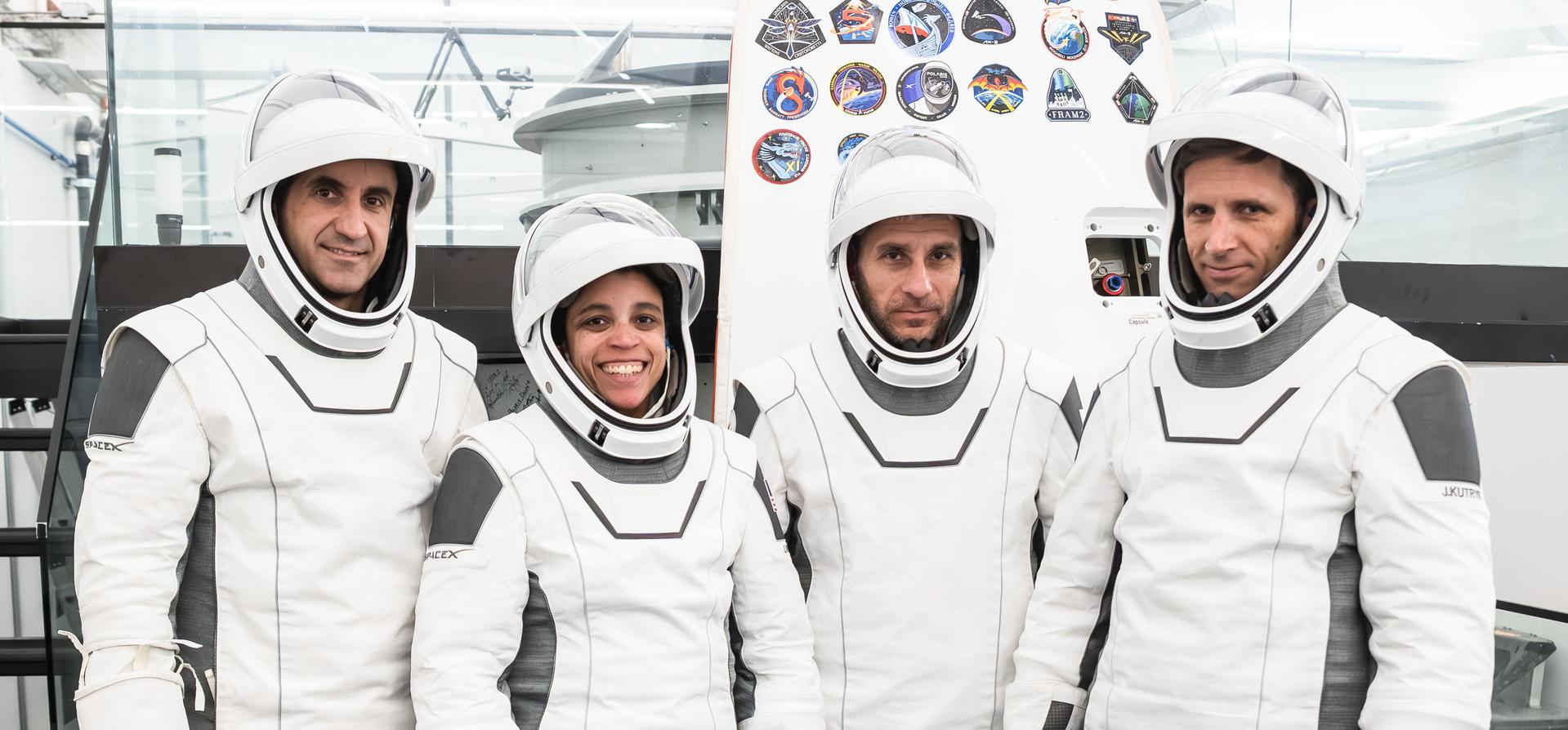 The SpaceX Crew-13 members pose for a portrait in their pressure suits during a preflight training session at the company's headquarters in Hawthorne, California. From left are, Roscosmos Sergey Teteryatnikov, NASA astronauts Jessica Watkins and Luke Delaney, and CSA (Canadian Space Agency) astronaut Joshua Kutryk.
