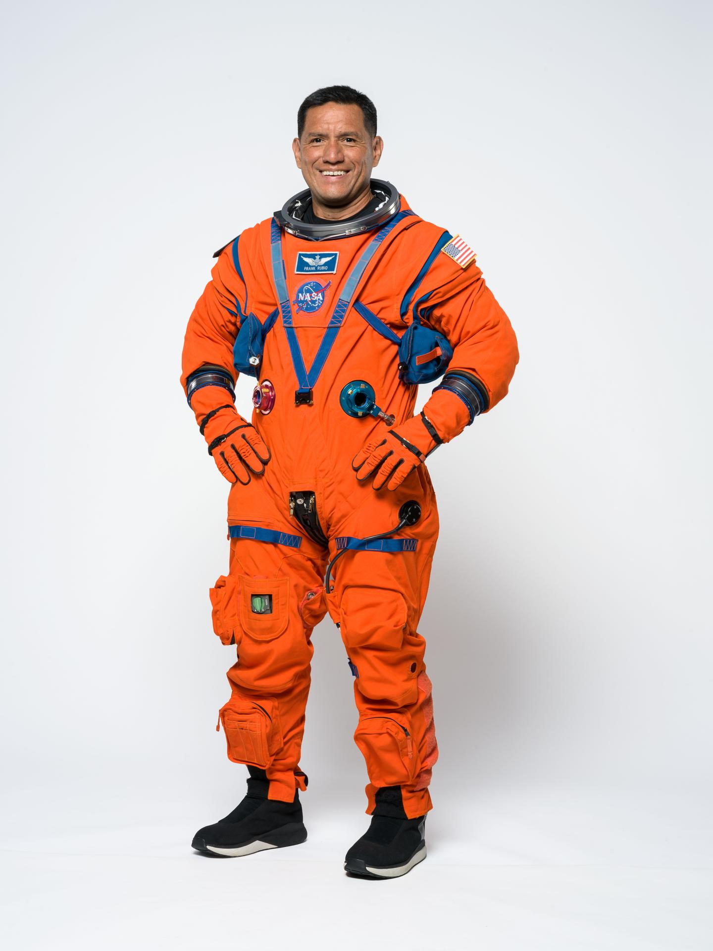 Artemis III mission specialist Frank Rubio poses for a portrait in the orange Orion Crew Survival System suit. Credit: NASA/Helen Arase Vargas 