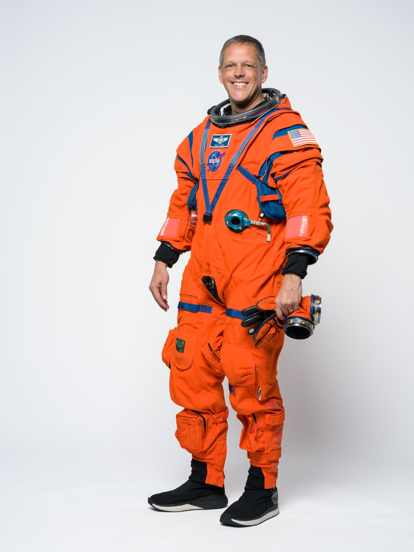 Artemis III backup crew member Bob Hines poses for a portrait in the orange Orion Crew Survival System suit. Credit: NASA/Helen Arase Vargas 