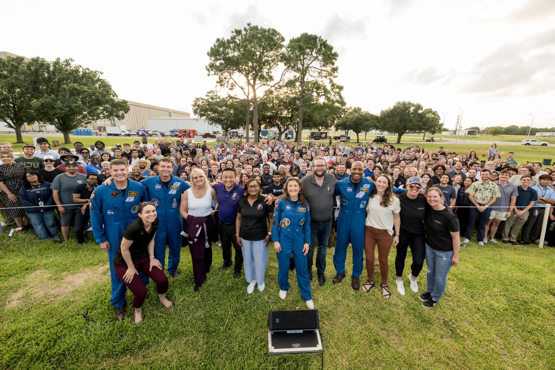 jsc2026e396706 (June 25, 2026) - NASA’s Artemis II crew along with NASA's Johnson Space Center Director Vanessa Wyche, Orion Program Manager Howard Hu, and other program team members pose with employees at an Artemis II employee celebration event at NASA's Johnson Space Center. Credit: NASA