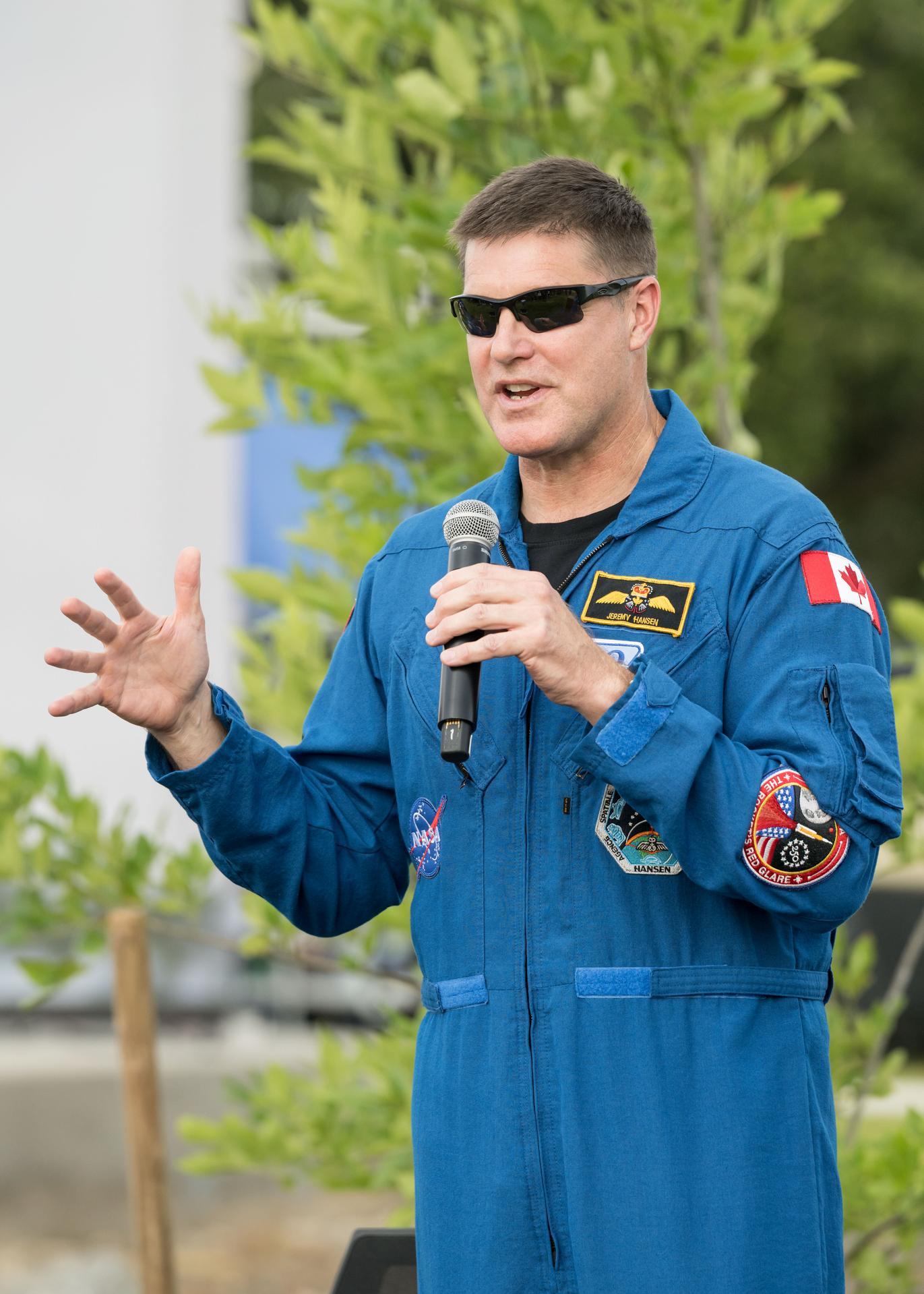 jsc2026e396754 (June 25, 2026) - CSA (Canadian Space Agency) astronaut Jeremy Hansen addresses the crowd at an Artemis II employee celebration event at NASA's Johnson Space Center. Credit: NASA