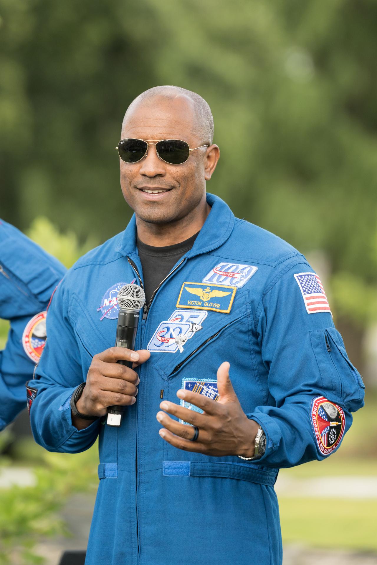 jsc2026e396756 (June 25, 2026) - NASA astronaut and Artemis II pilot Victor Glover addresses the crowd at an Artemis II employee celebration event at NASA's Johnson Space Center. Credit: NASA