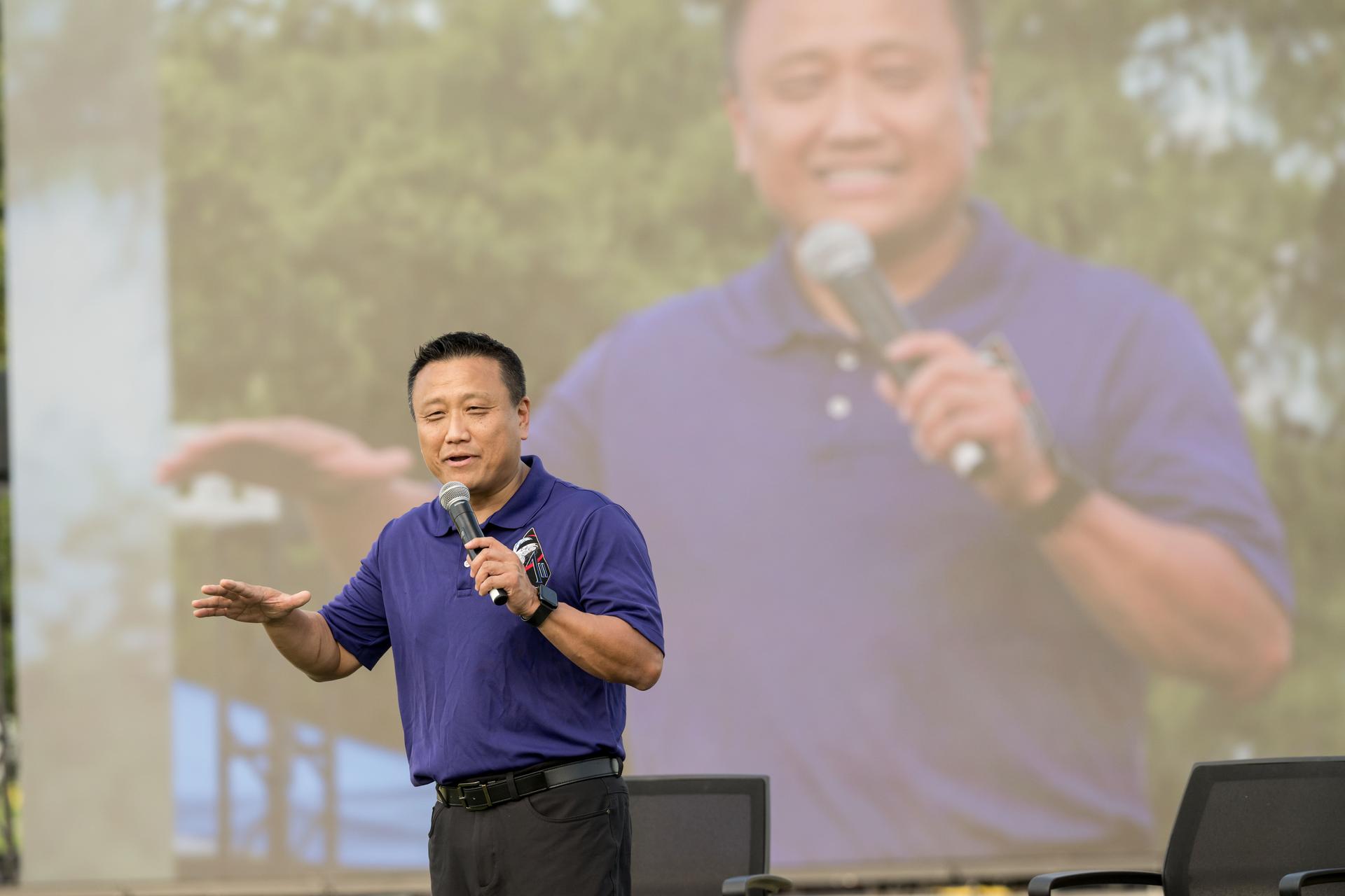 jsc2026e396769 (June 25, 2026) - Orion Program Manager Howard Hu addresses the crowd at the Artemis II employee celebration event at NASA's Johnson Space Center. Credit: NASA