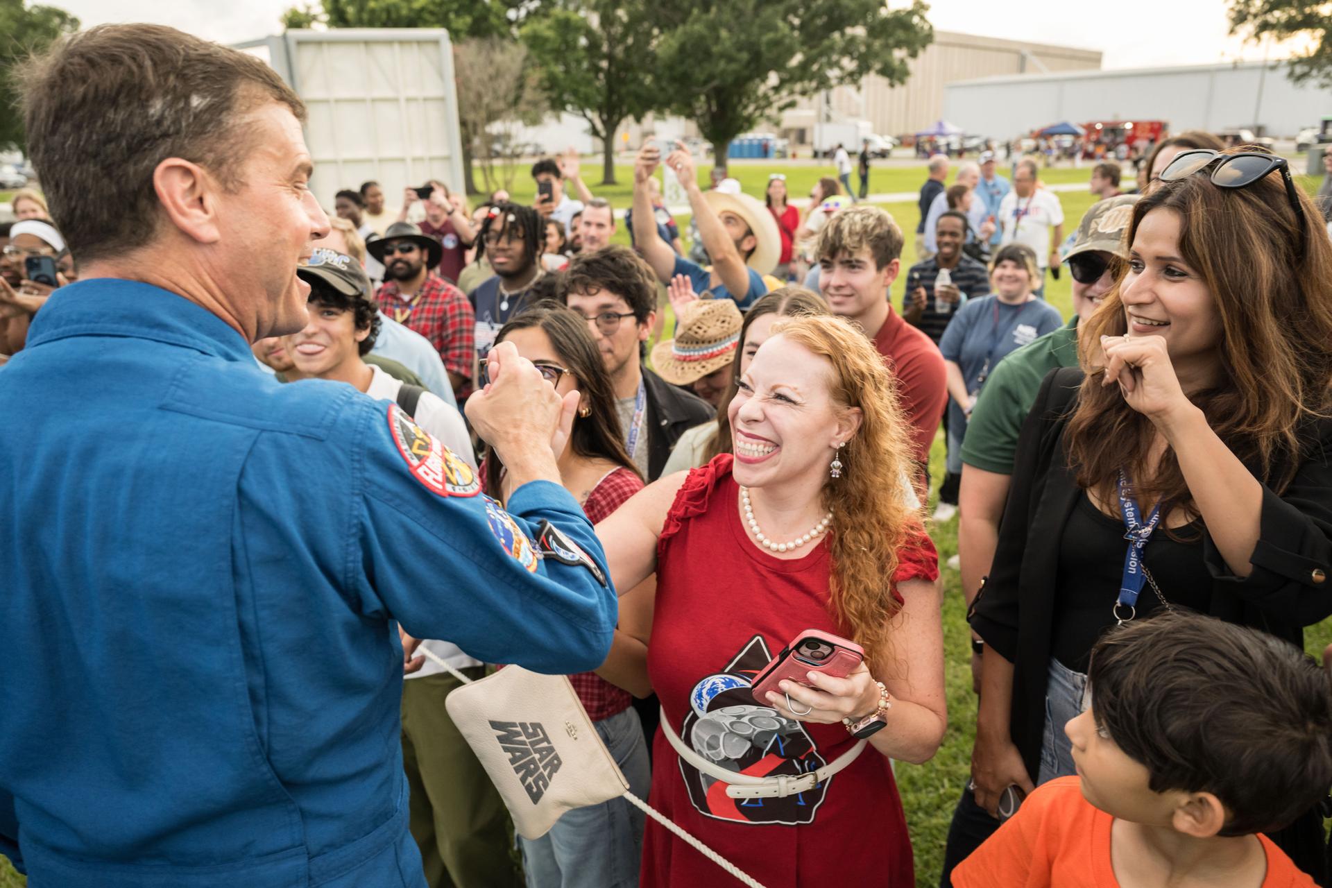 jsc2026e396796 (June 25, 2026) - NASA astronaut Reid Wiseman speaks with attendees at an Artemis II employee celebration event at NASA's Johnson Space Center. Credit: NASA