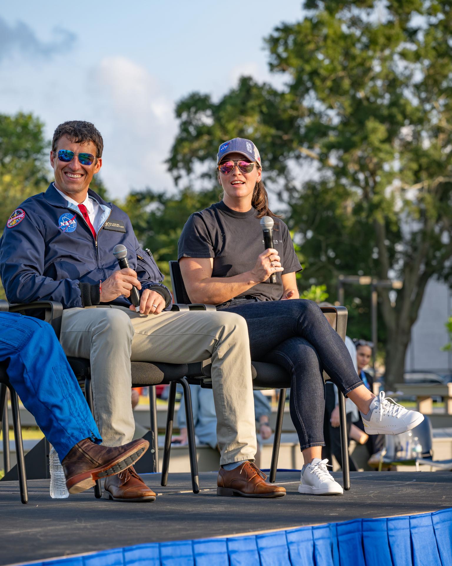 jsc2026e397497 (June 25, 2026) - NASA Flight Director Rick Henfling and Artemis II Orion Vehicle Manager Branelle Rodriguez answer questions from the Artemis II crew during an employee celebration event at NASA's Johnson Space Center. Credit: NASA