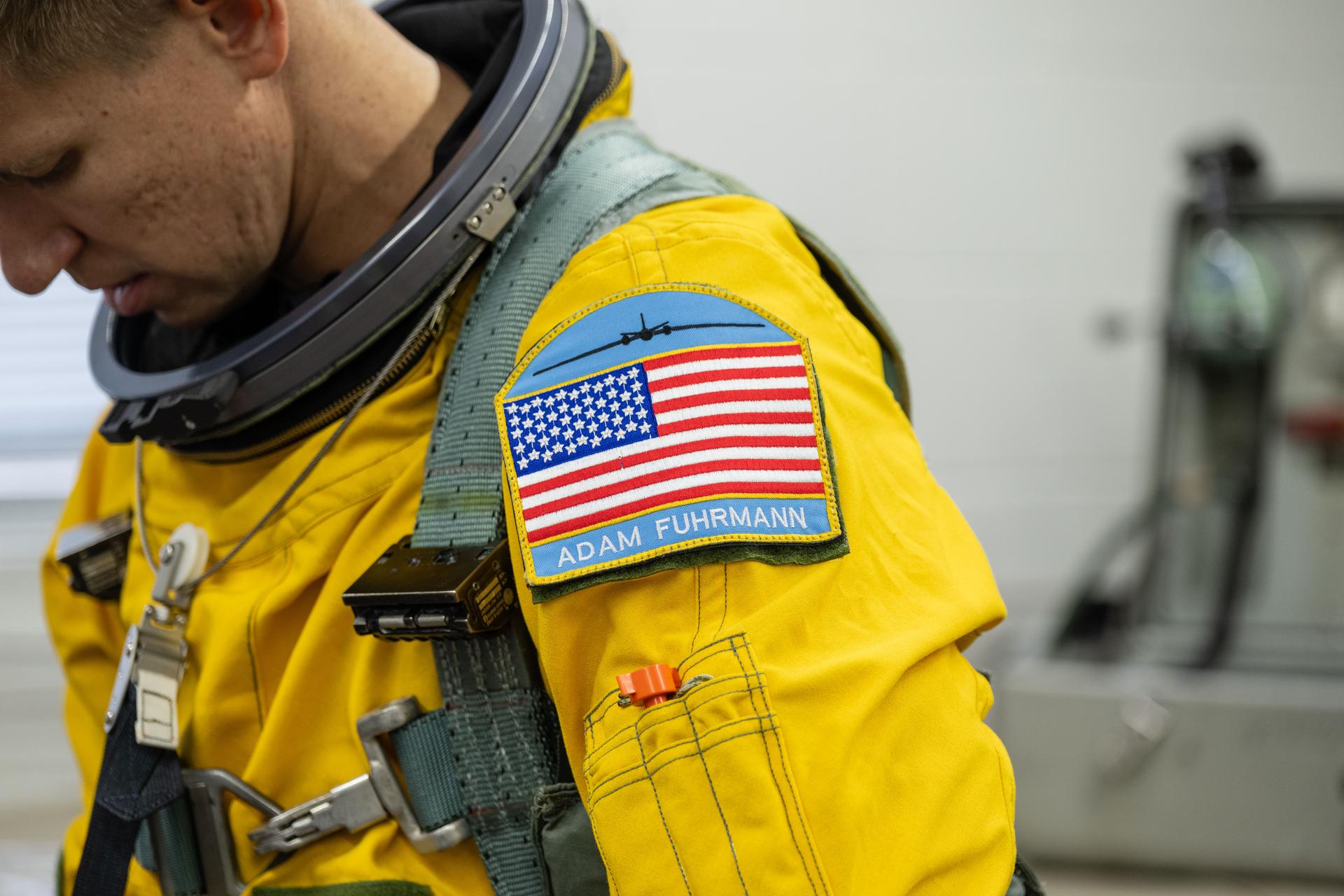 jsc2026e402008 (July 15, 2026) --- NASA astronaut candidate Adam Fuhrmann prepares for a training flight aboard NASA’s WB-57 aircraft. These high-altitude flights train the crew to work in a tight environment and operate aircraft systems while in a pressure suit, preparing them for future missions to the International Space Station, Moon, or beyond. Photo: NASA/Josh Valcarcel