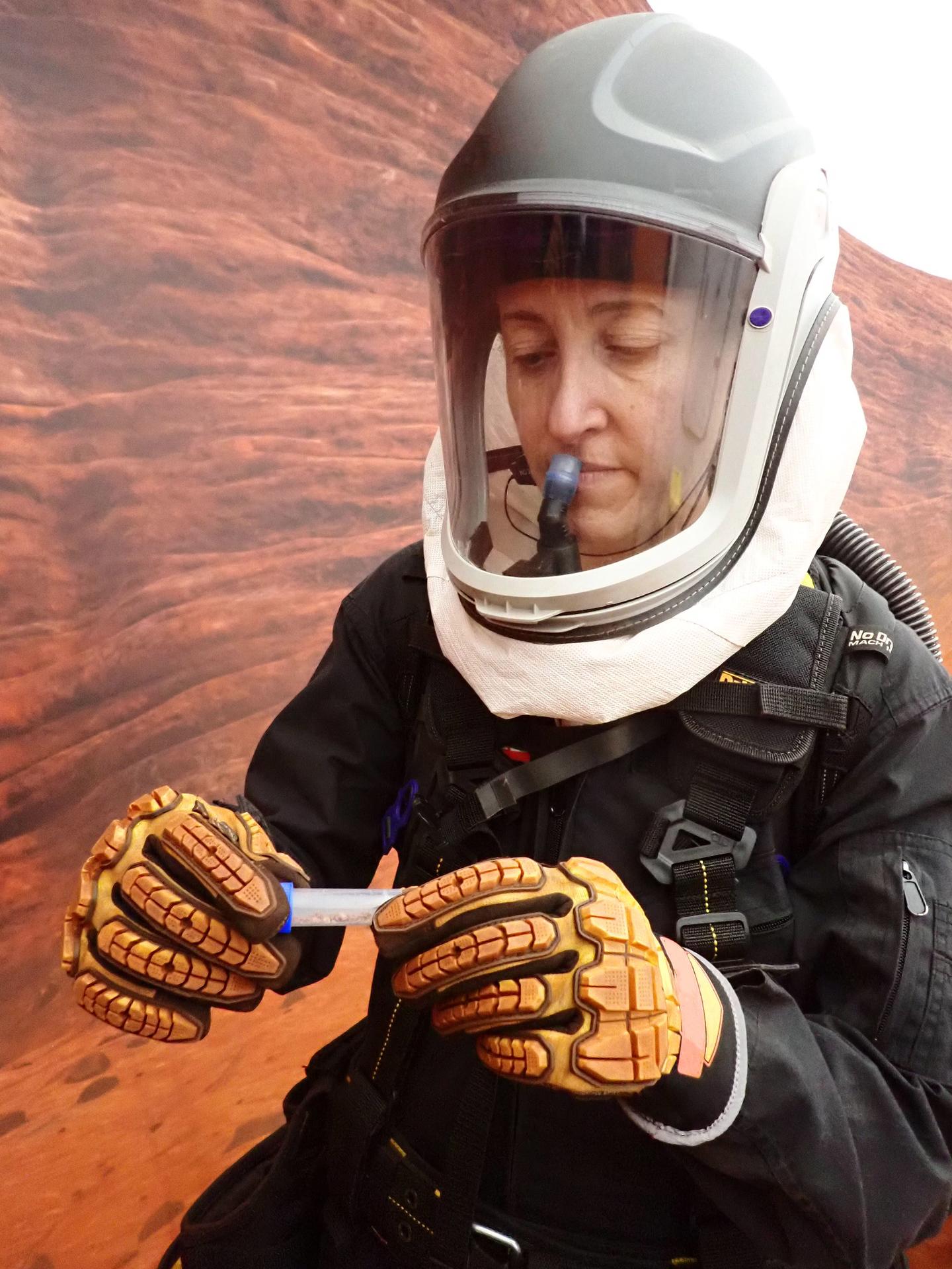jsc2026e403171 (Feb. 27, 2026) -- CHAPEA mission 2 medical officer, Ellen Ellis, collects samples during an extravehicular activity, also known as a spacewalk. Credit: NASA
