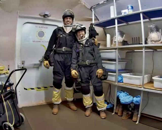 jsc2026e409151 (Aug. 1, 2026) -- Crew Health and Performance Exploration Analog (CHAPEA) Mission 2 commander, Ross Elder, and CHAPEA Mission 2 medical officer, Ellen Ellis, stands in the airlock ready to go on EVA. Credit: NASA
