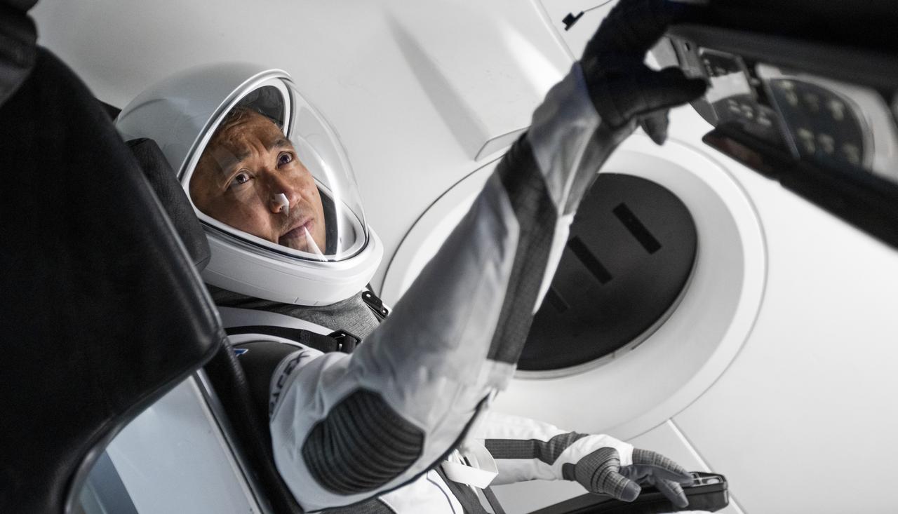 JAXA astronaut Koichi Wakata wears a SpaceX launch and entry suit while becoming familiar with the Crew Dragon spacecraft that will take Wakata and his crewmates to the International Space Station as part of NASA's SpaceX Crew-5 mission to the International Space Station.