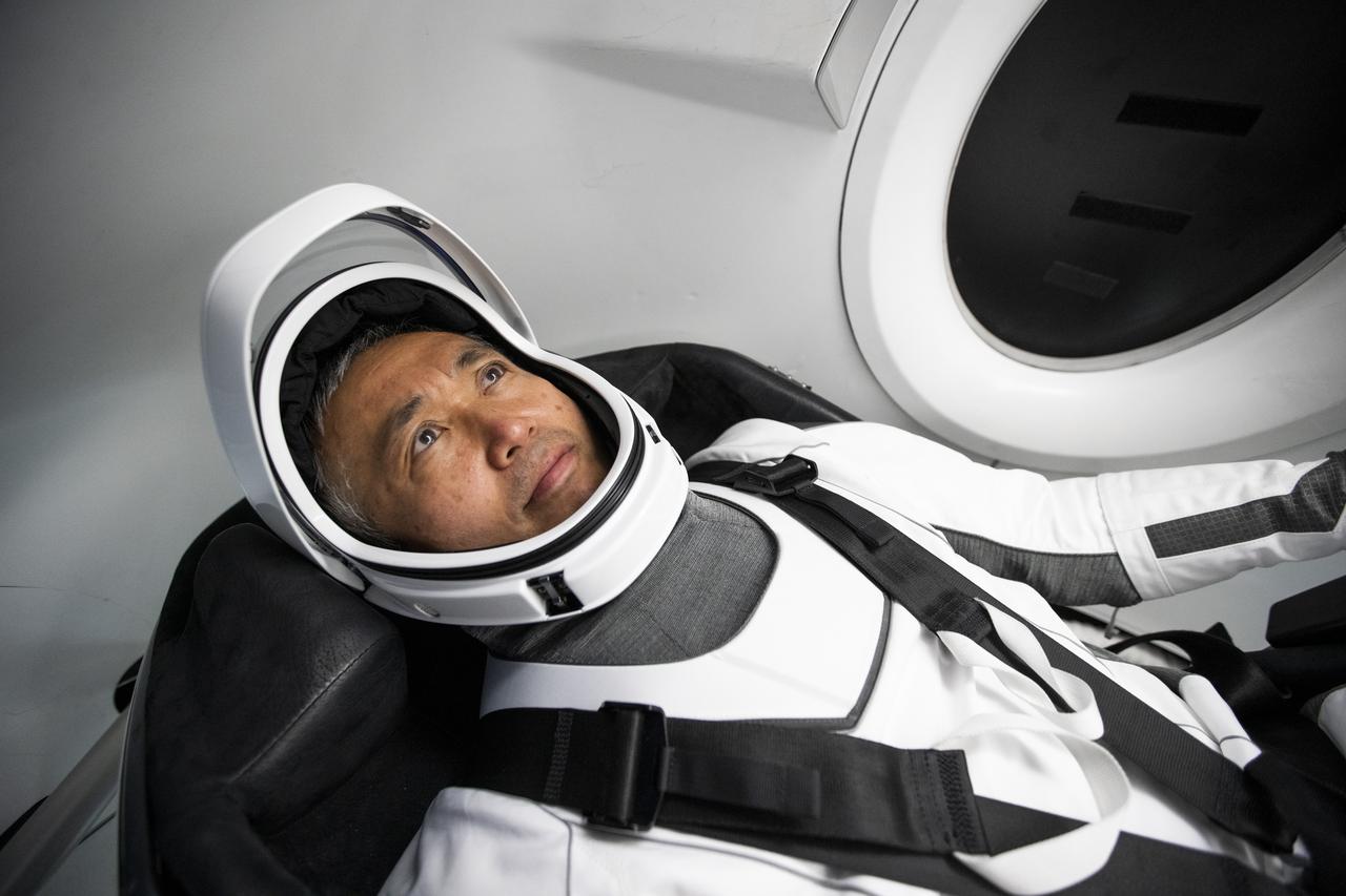 JAXA astronaut Koichi Wakata wears a SpaceX launch and entry suit while becoming familiar with the Crew Dragon spacecraft that will take Wakata and his crewmates to the International Space Station as part of NASA's SpaceX Crew-5 mission to the International Space Station.