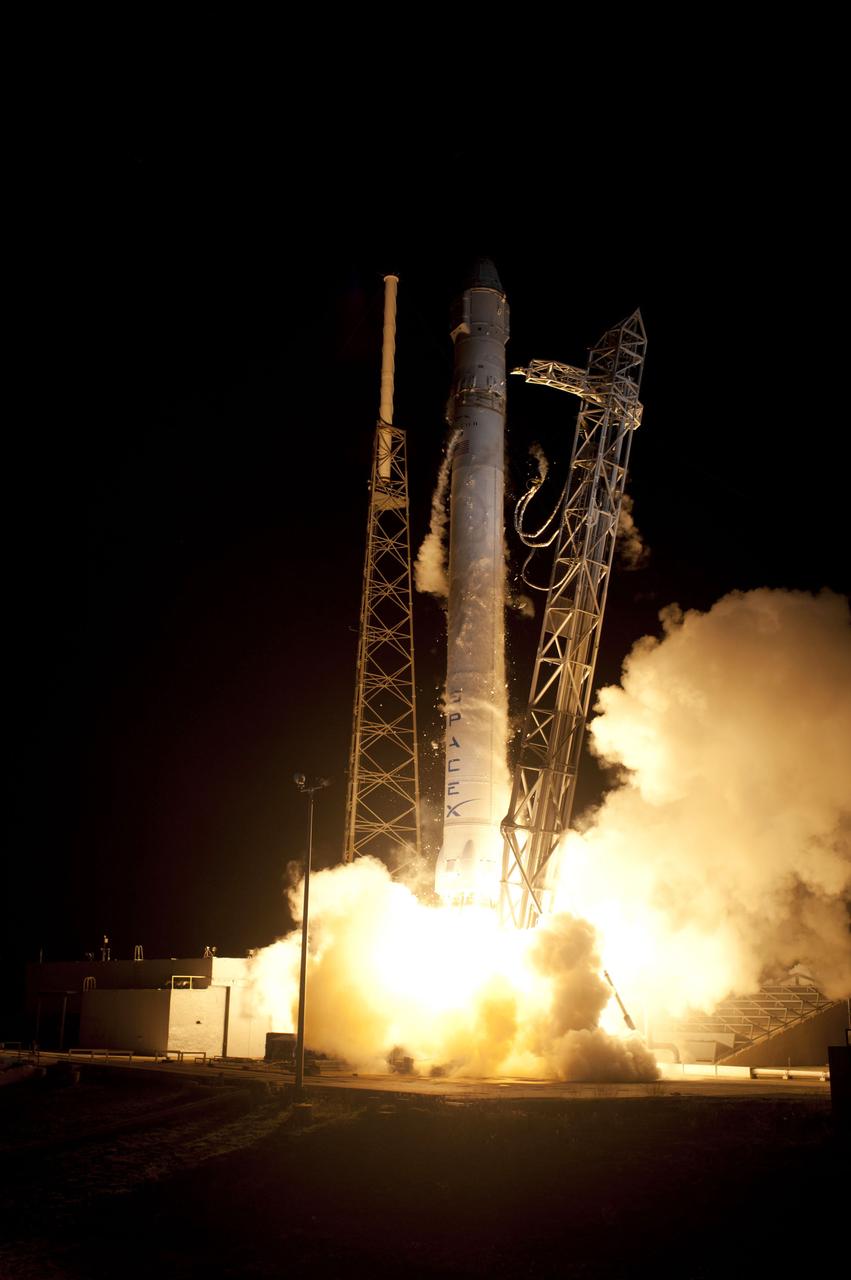 CAPE CANAVERAL, Fla. – Frost and ice breaks away from the SpaceX Falcon 9 rocket as its Merlin engines ignite at 3:44 a.m. EDT at Space Launch Complex-40 on Cape Canaveral Air Force Station in Florida. The launch is the company's second demonstration test flight for NASA's Commercial Orbital Transportation Services, or COTS, Program. During the flight, the Dragon capsule will conduct a series of check-out procedures to test and prove its systems, including rendezvous and berthing with the International Space Station. If the capsule performs as planned, the cargo and experiments it is carrying will be transferred to the station. The cargo includes food, water and provisions for the station’s Expedition crews, such as clothing, batteries and computer equipment. Under COTS, NASA has partnered with two aerospace companies to deliver cargo to the station. For more information, visit http://www.nasa.gov/spacex. Photo credit: NASA/Rick Wetherington, Tim Powers and Tim Terry