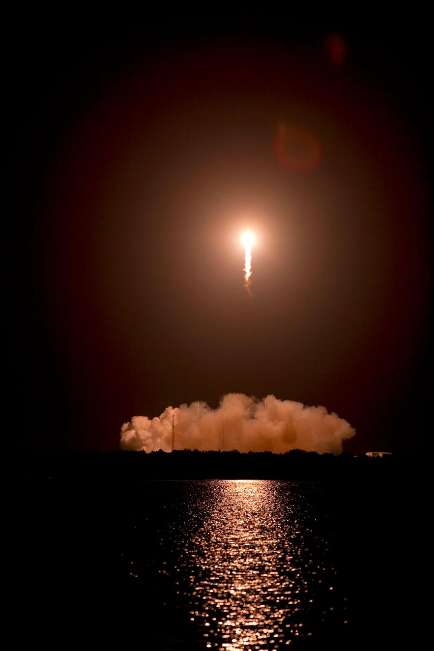 CAPE CANAVERAL, Fla. -- A Falcon 9 rocket cuts its way through the clouds over Space Launch Complex 40 on Cape Canaveral Air Force Station in Florida carrying a Dragon capsule to orbit. Launch was at 8:35 p.m. EDT. Space Exploration Technologies Corp., or SpaceX, built both the rocket and capsule for NASA's first Commercial Resupply Services, or CRS-1, mission to the International Space Station. SpaceX CRS-1 is an important step toward making America’s microgravity research program self-sufficient by providing a way to deliver and return significant amounts of cargo, including science experiments, to and from the orbiting laboratory. NASA has contracted for 12 commercial resupply flights from SpaceX and eight from the Orbital Sciences Corp. For more information, visit http://www.nasa.gov/mission_pages/station/living/launch/index.html. Photo credit: NASA/Glenn Benson