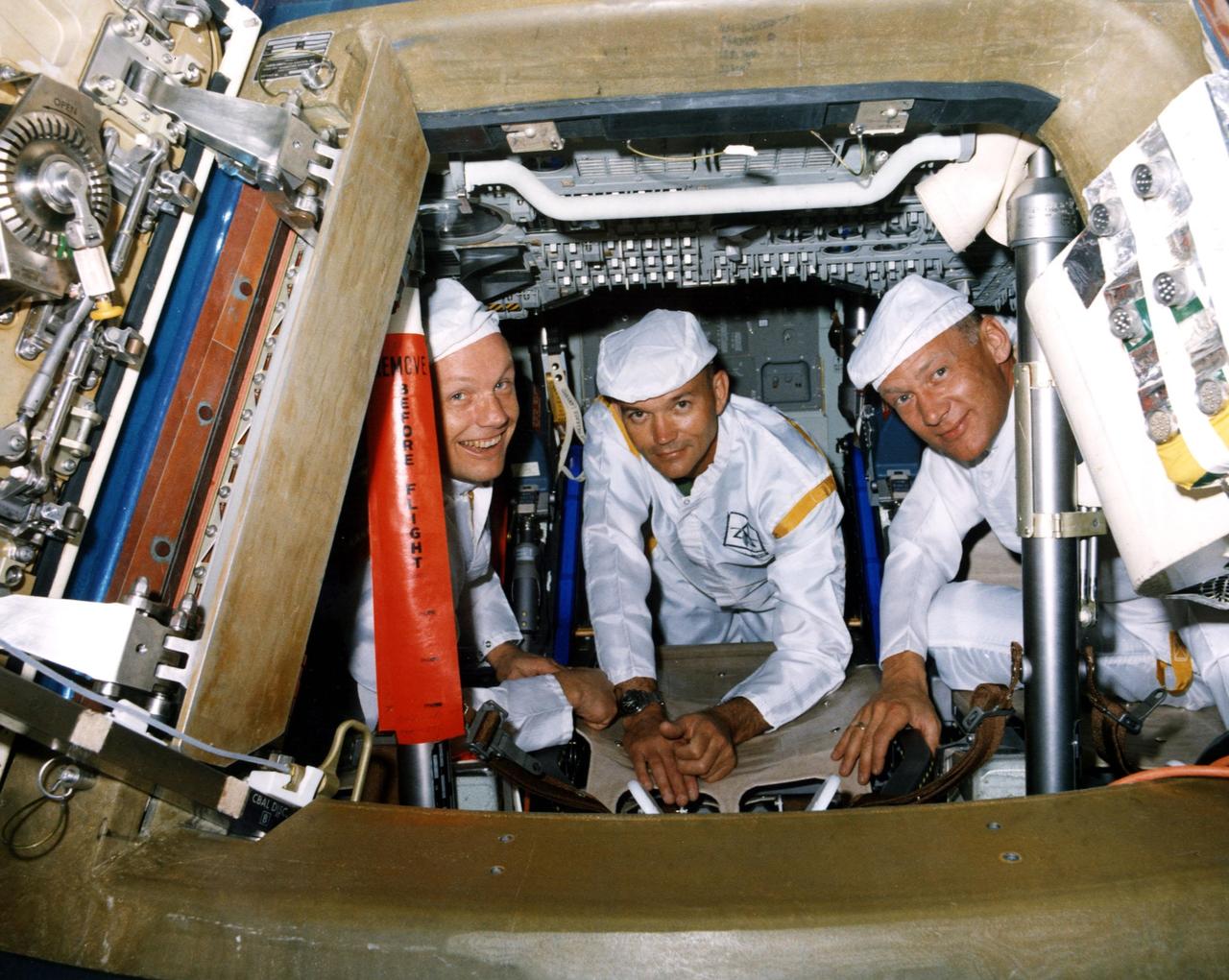 KENNEDY SPACE CENTER, FLA. -- The Apollo 11 prime crew poses for a photograph during a walk-through egress test. The hands-on test is in preparation for the first manned lunar landing mission scheduled for liftoff in July