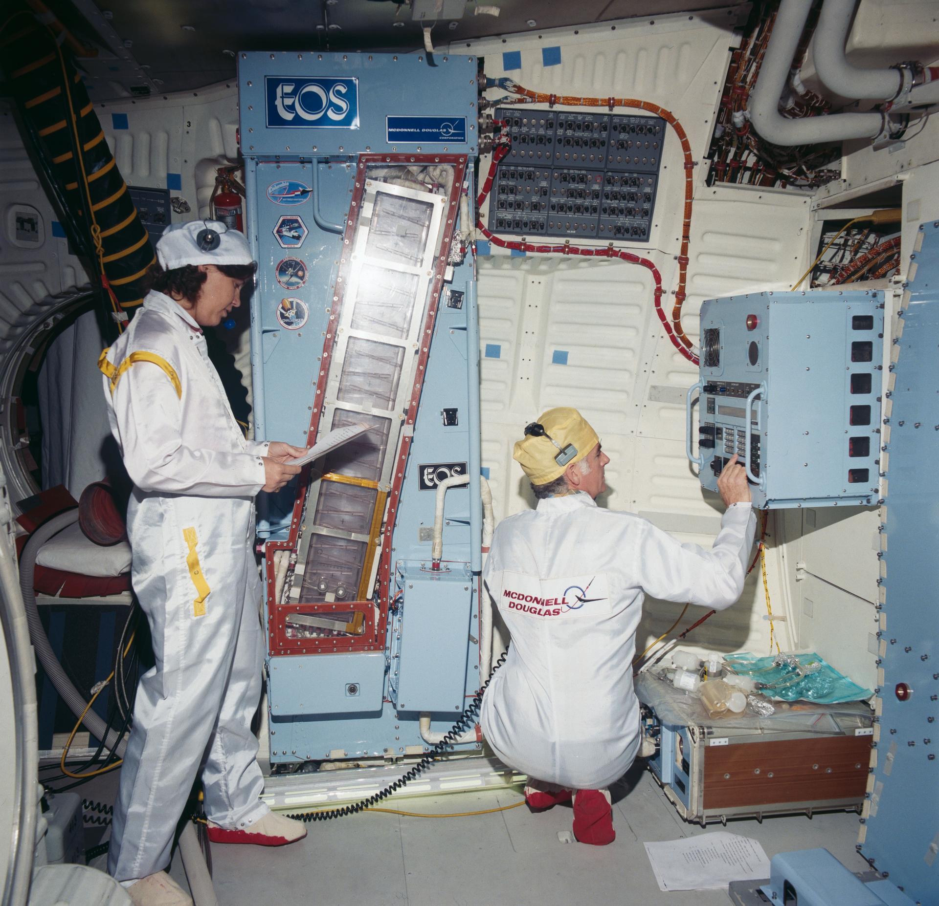 The Continuous Flow Electrophoresis System (CFES) is installed in the middeck of the Orbiter Discovery in preparation for STS-41D