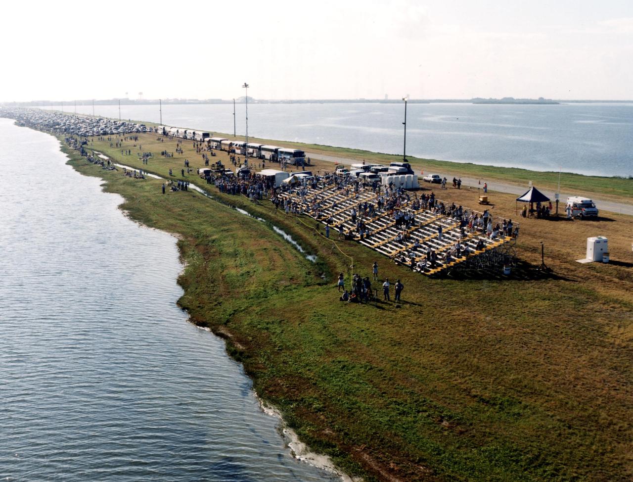 KENNEDY SPACE CENTER, FLA. -- NASA employees, their families and friends gather on the NASA Causeway over the Banana River, south of Kennedy Space Center, the morning of the launch of STS-26 and the Space Shuttle Discovery. An estimated 1 million people were expected to view the 11:37 a.m. launch from various locations in Central Florida